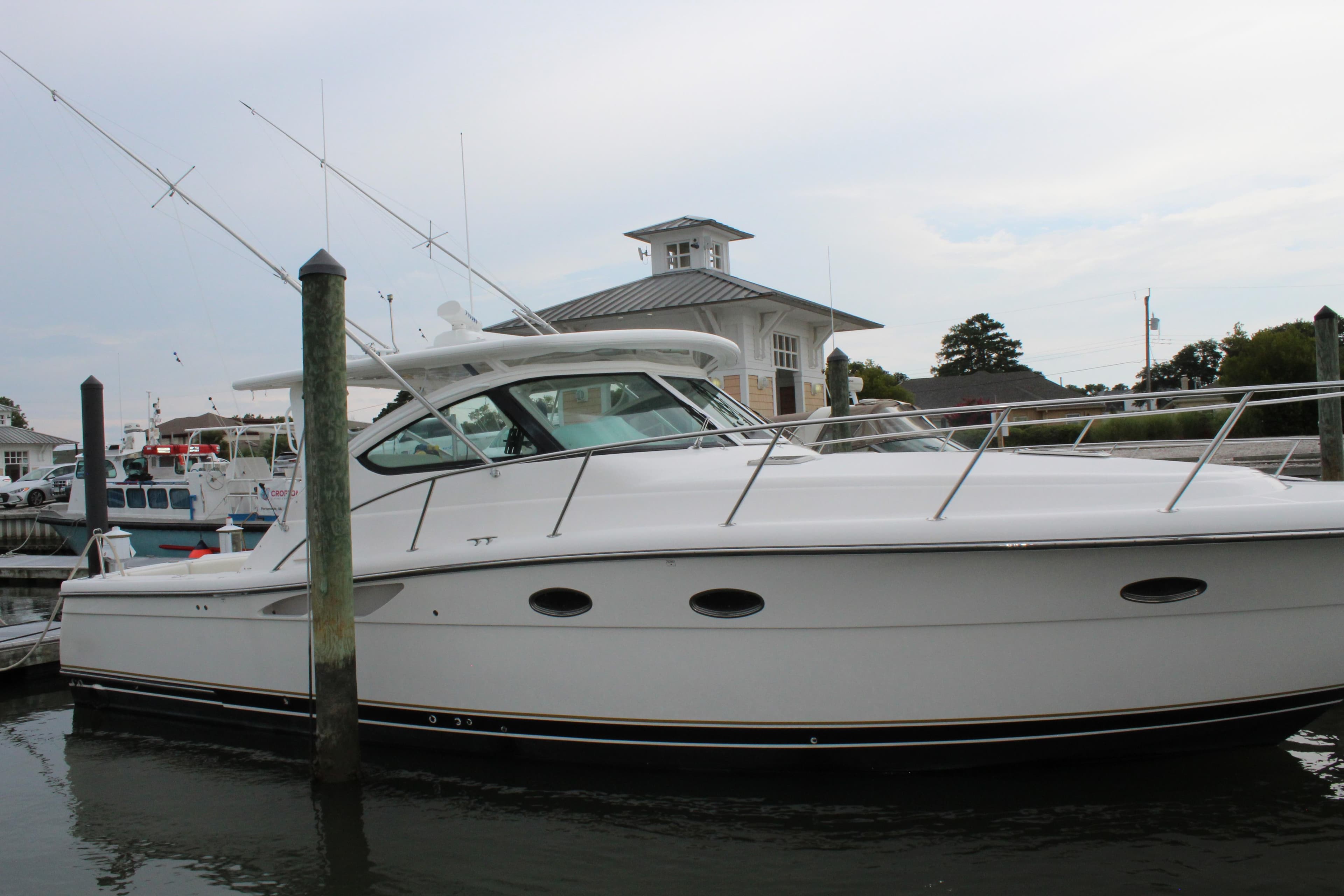 2002 Tiara Yachts 3800 Open docked at a marina.