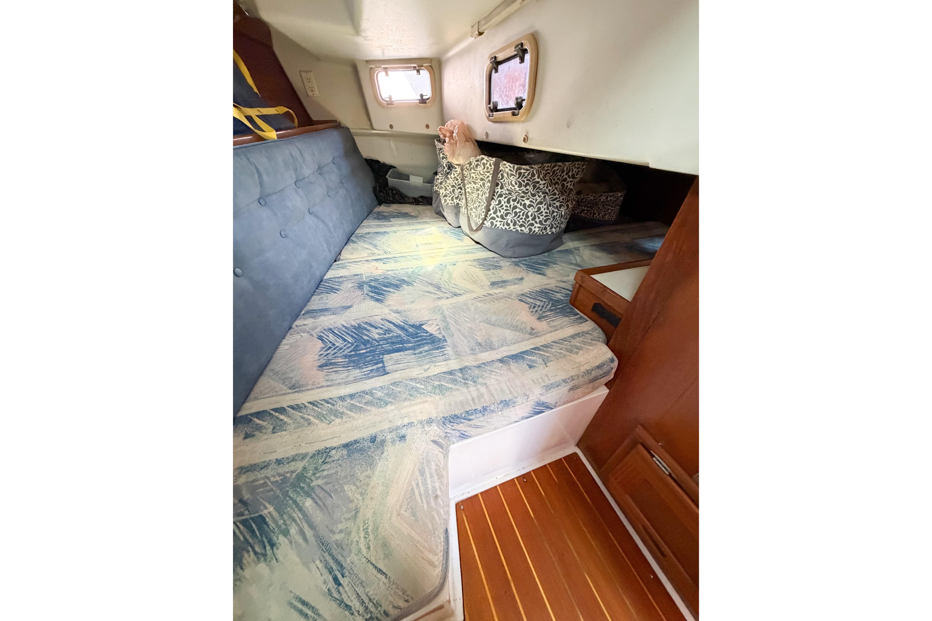 Interior cabin of a 1996 Catalina 36 MkII sailboat with patterned cushions.