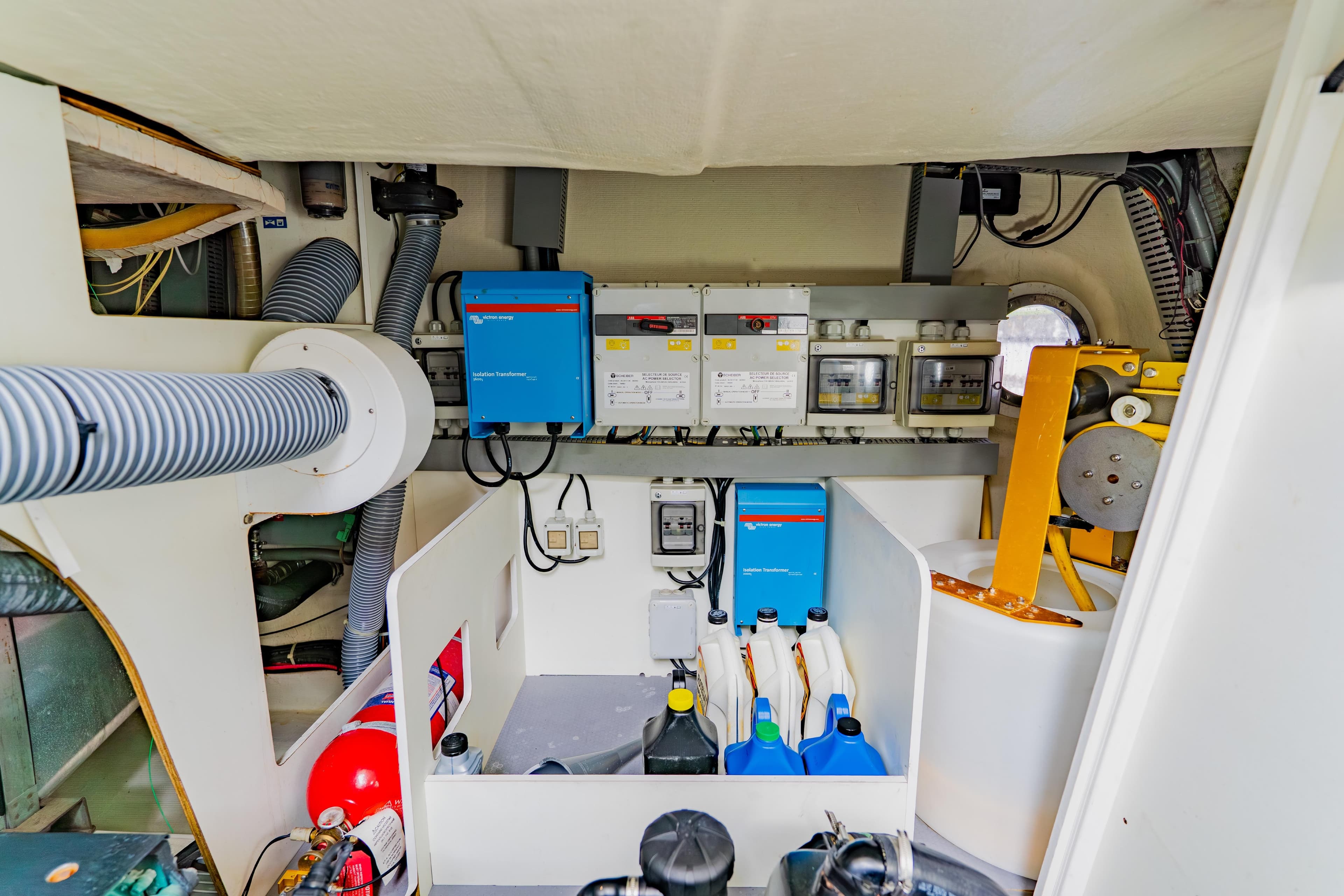 Engine room of 2015 Monte Carlo MC5 yacht with equipment and storage.