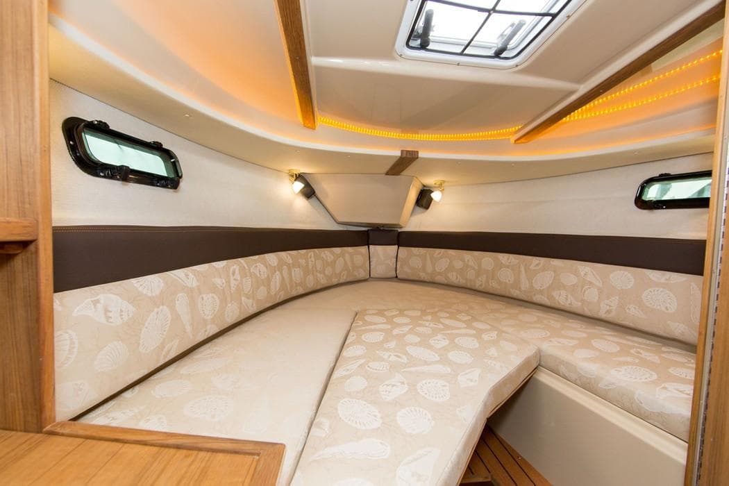Manufacturer Provided Image: 2021 Ranger Tugs R-27 cabin interior with cozy seating and ambient lighting.