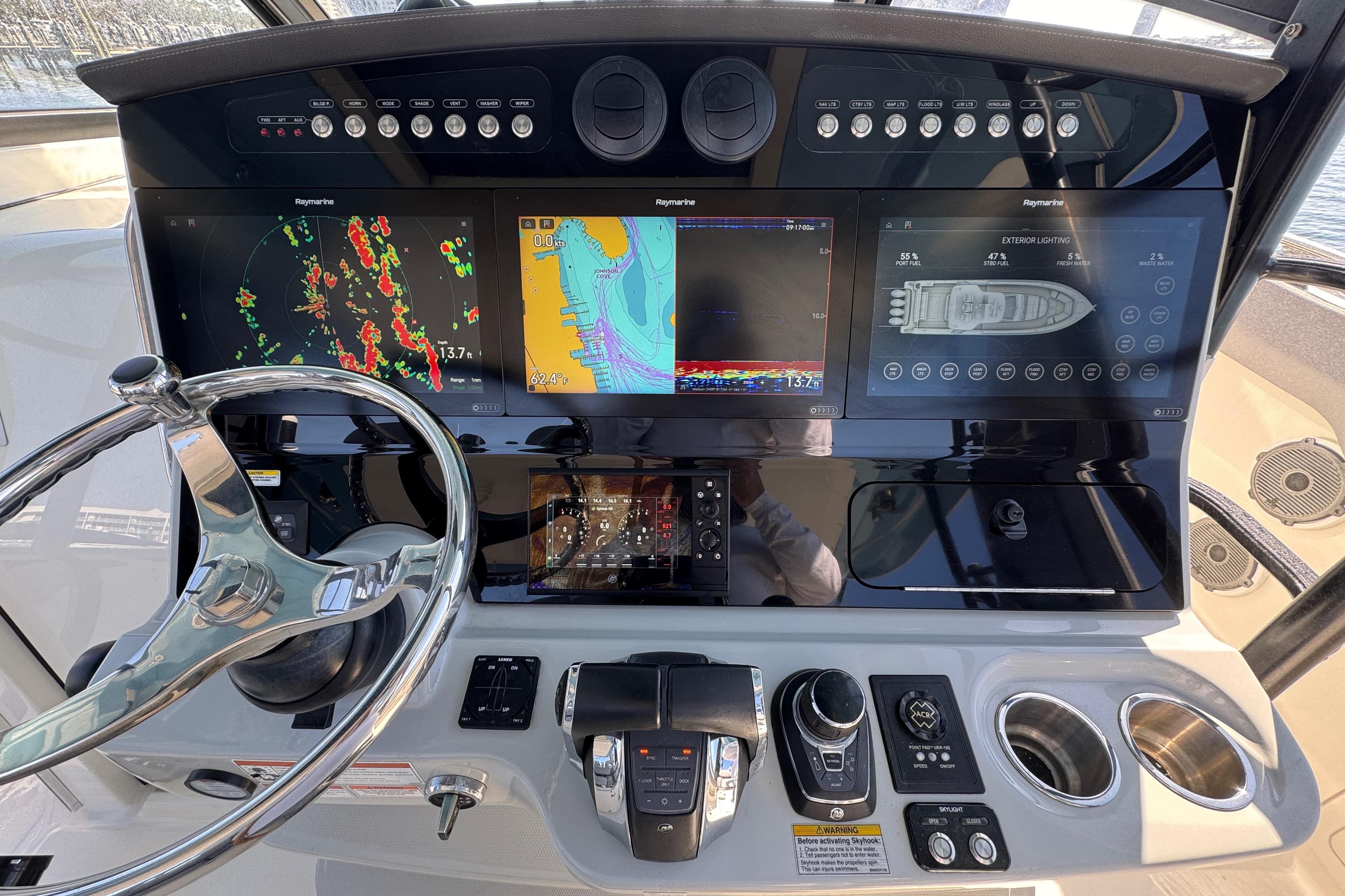 Dashboard of a 2021 Boston Whaler 420 Outrage with advanced navigation displays.