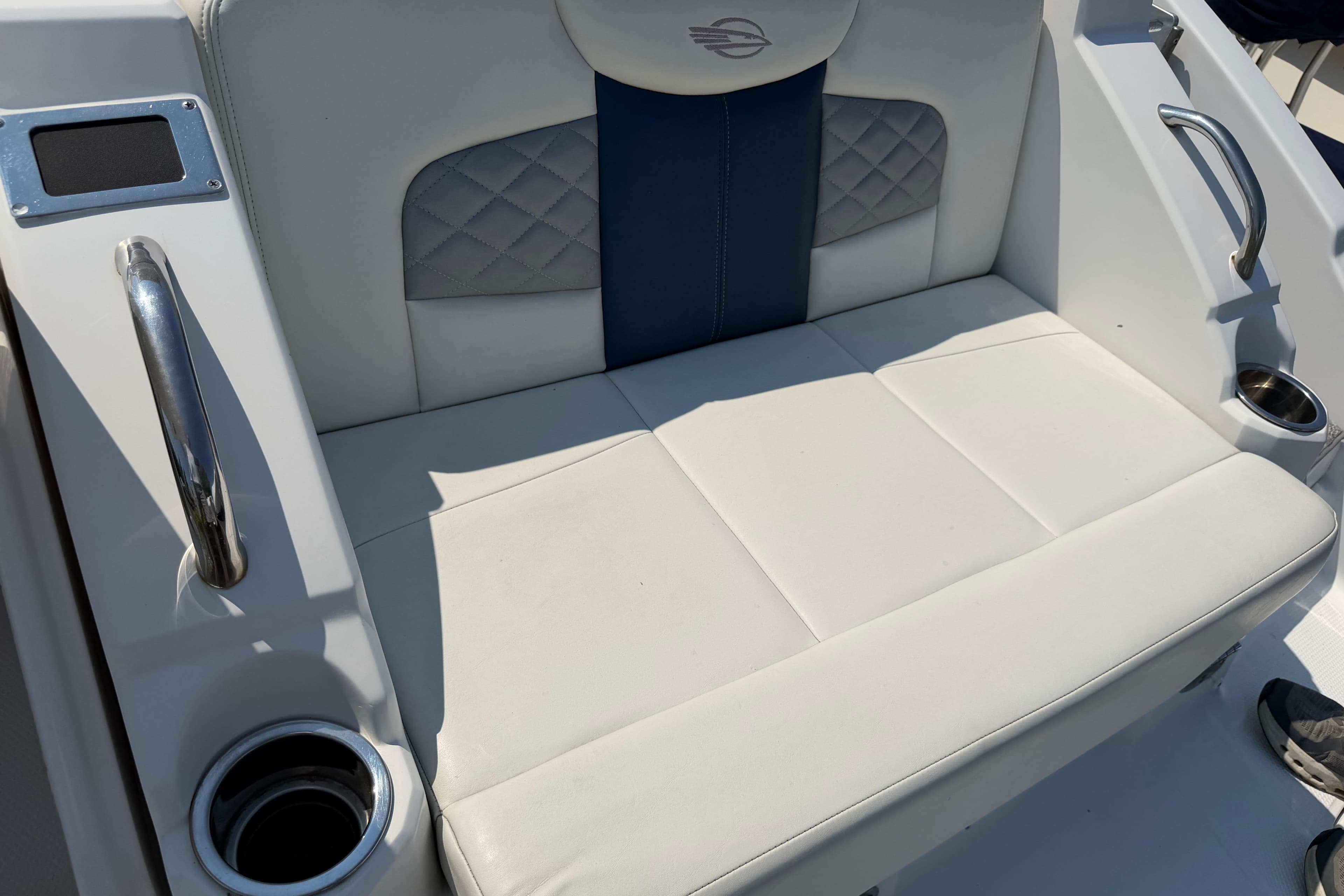 Chaparral 327 SSX 2012 boat seating with cup holders and stylish upholstery.