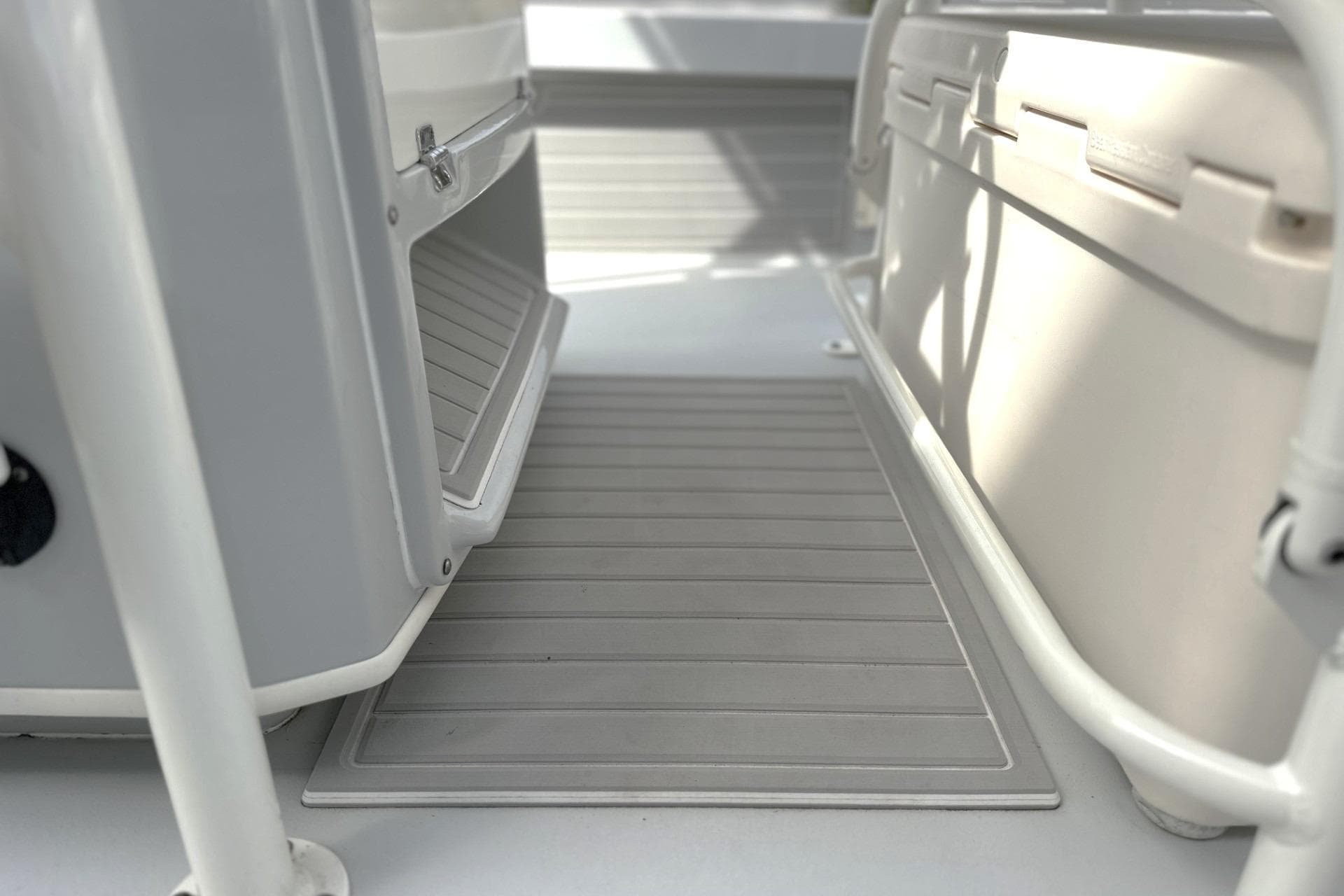 2024 Pathfinder 2200 TRS boat interior with storage compartment and cooler.