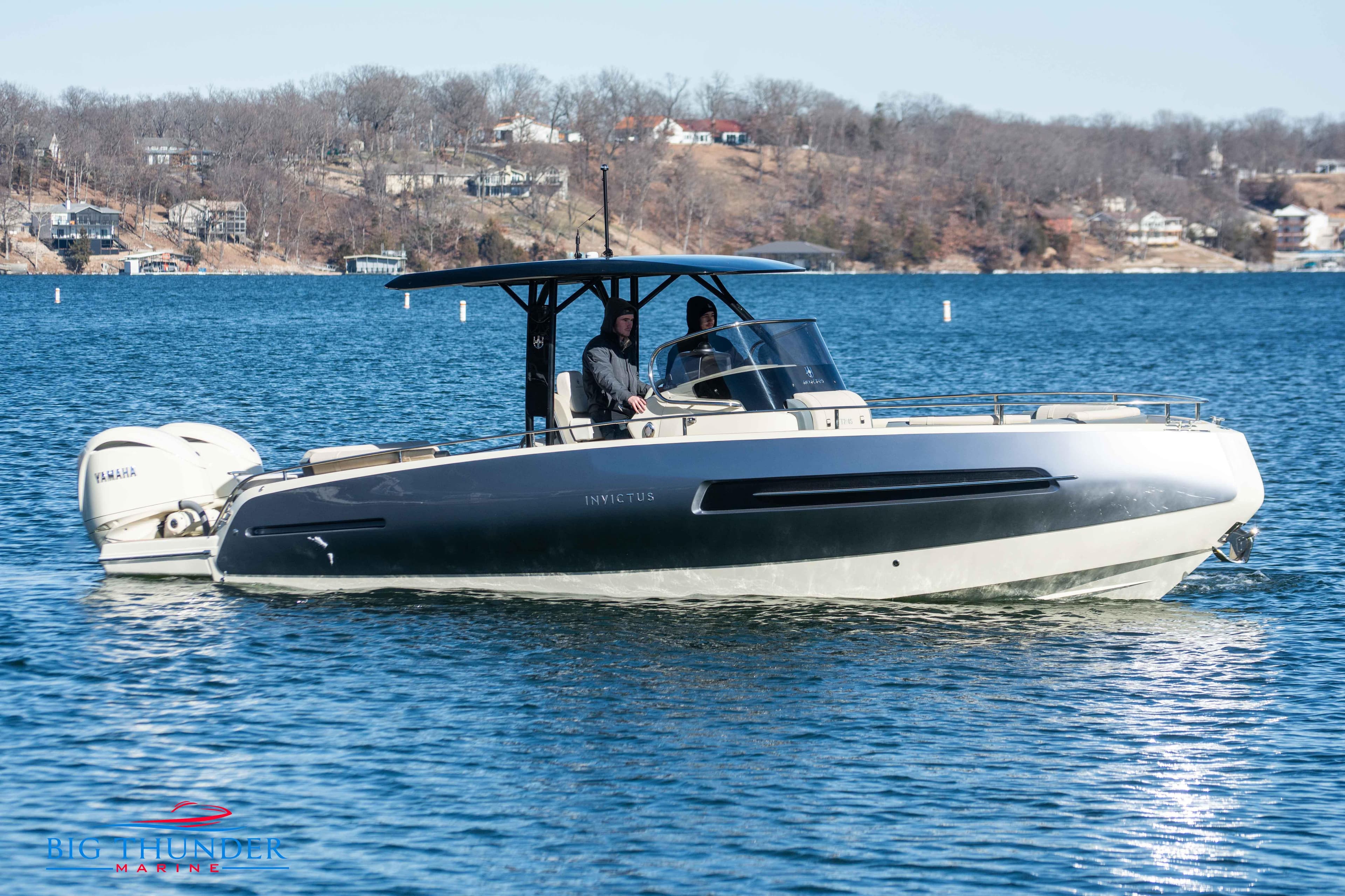 2024 Invictus TT280S motorboat cruising on a lake.