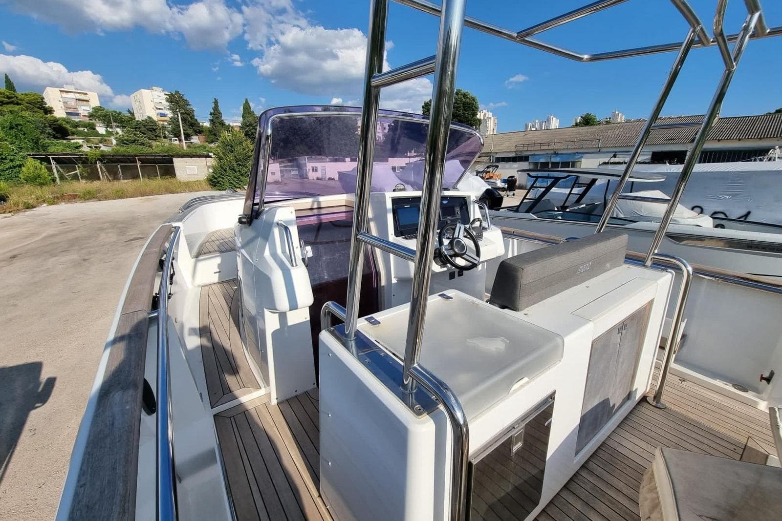 2015 Fjord 36' Open boat with modern cockpit and sleek design.