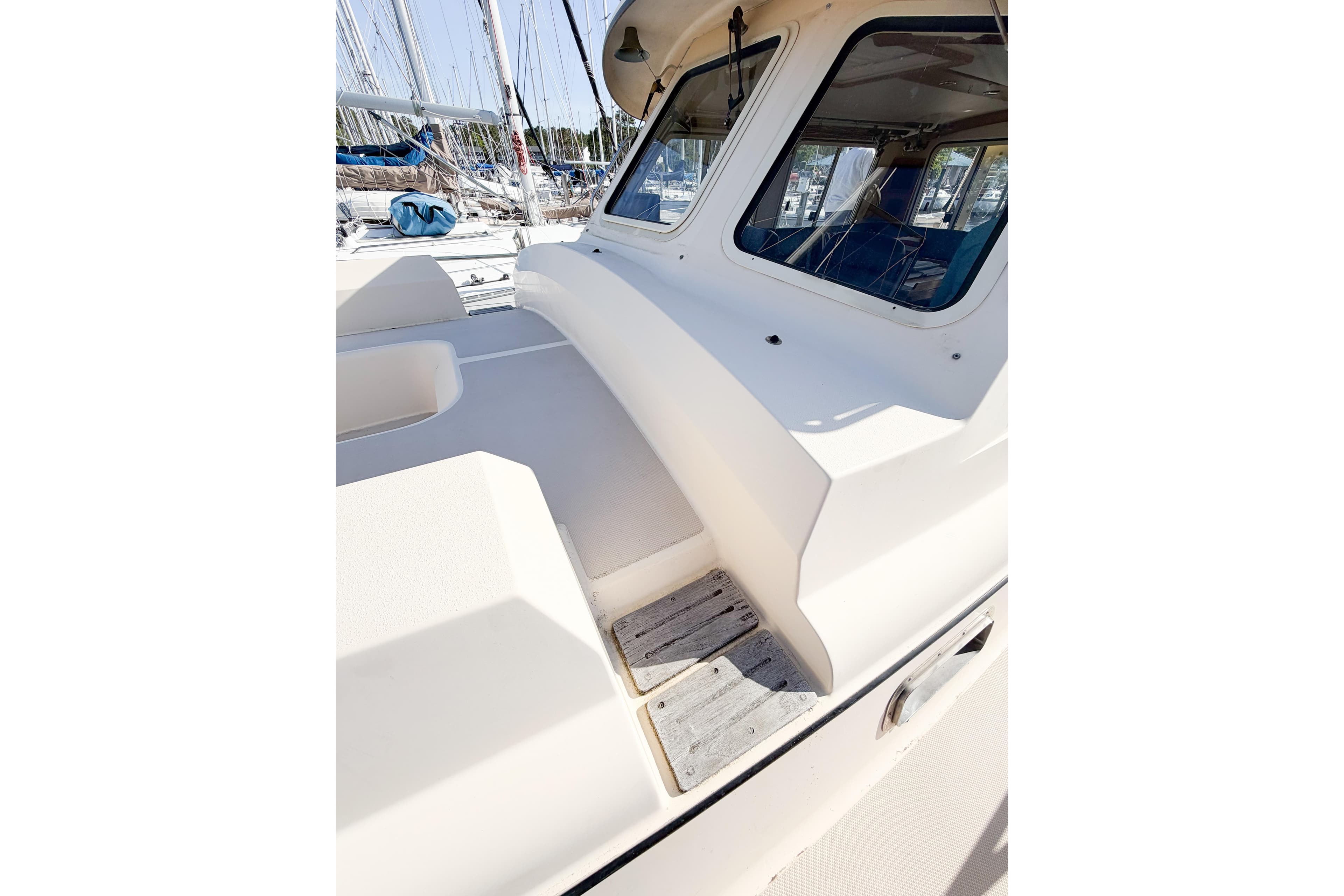 2007 Island Packet SP Cruiser deck view with windows and seating area.