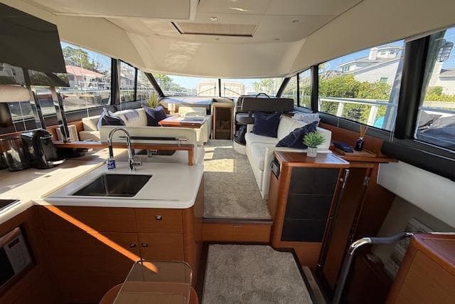 Luxurious interior of a 2015 Prestige 500 yacht with modern furnishings.