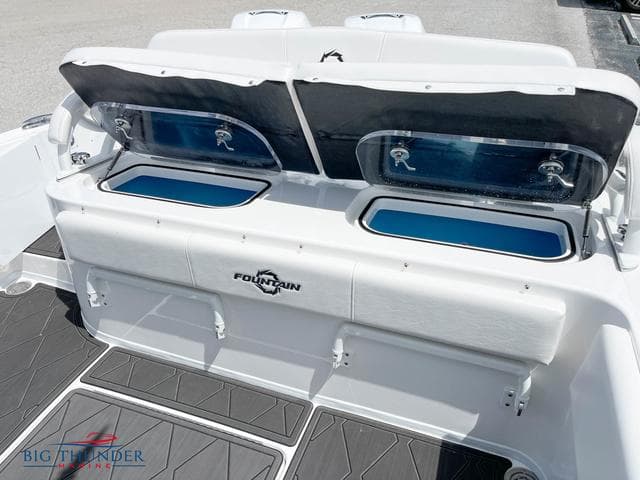 2023 Fountain 34 TE boat with open storage compartments and seating.