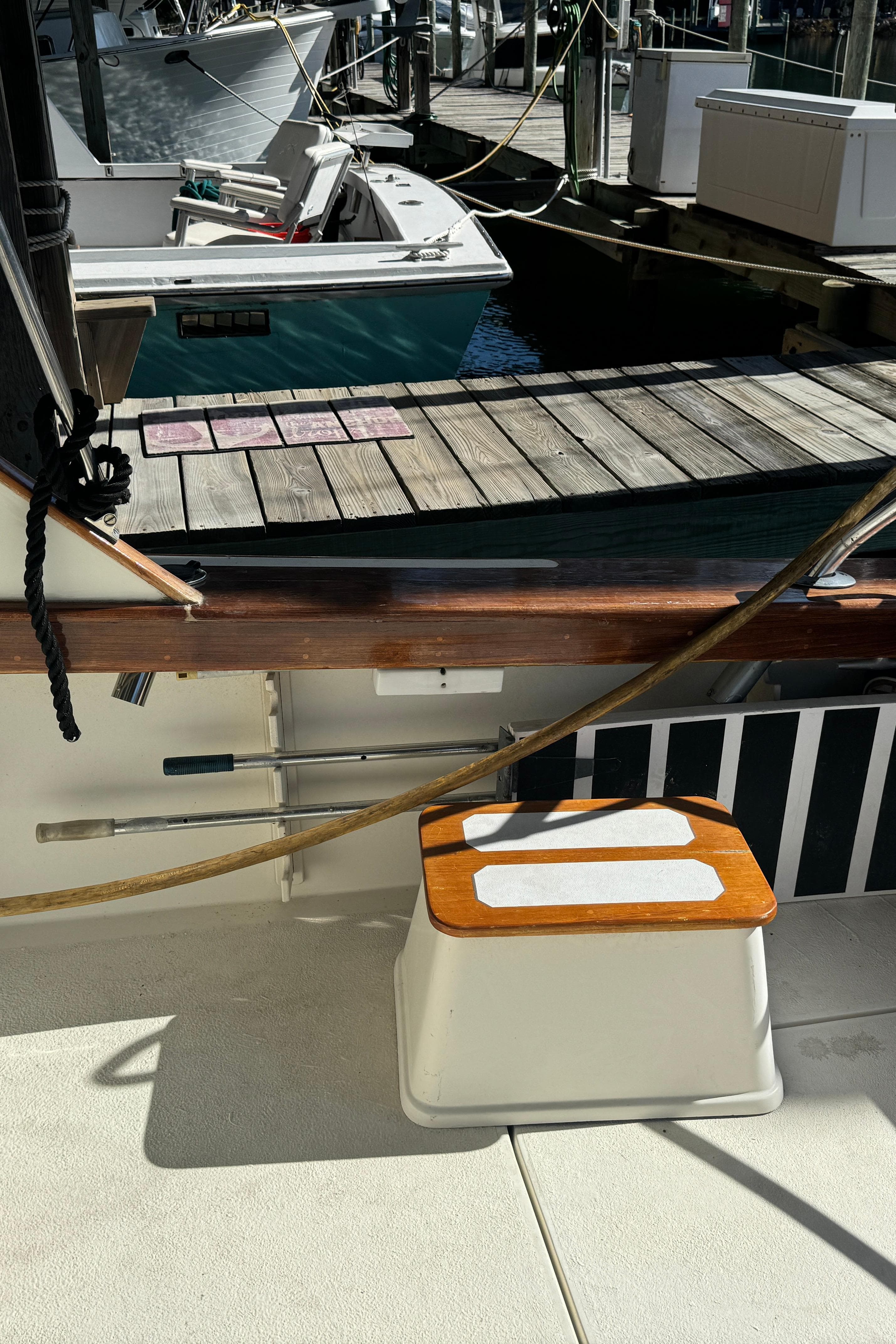 1992 Post 46 Sportfish boat docked, featuring deck details and nearby vessels.