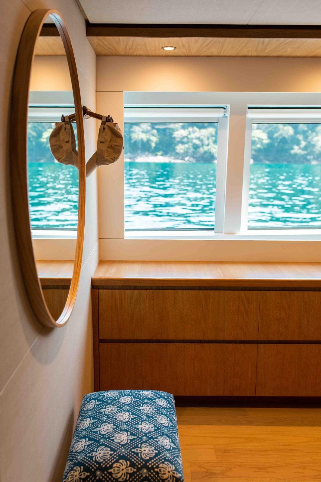 Luxurious interior of 2027 Inace Explora 90 yacht with scenic window view.