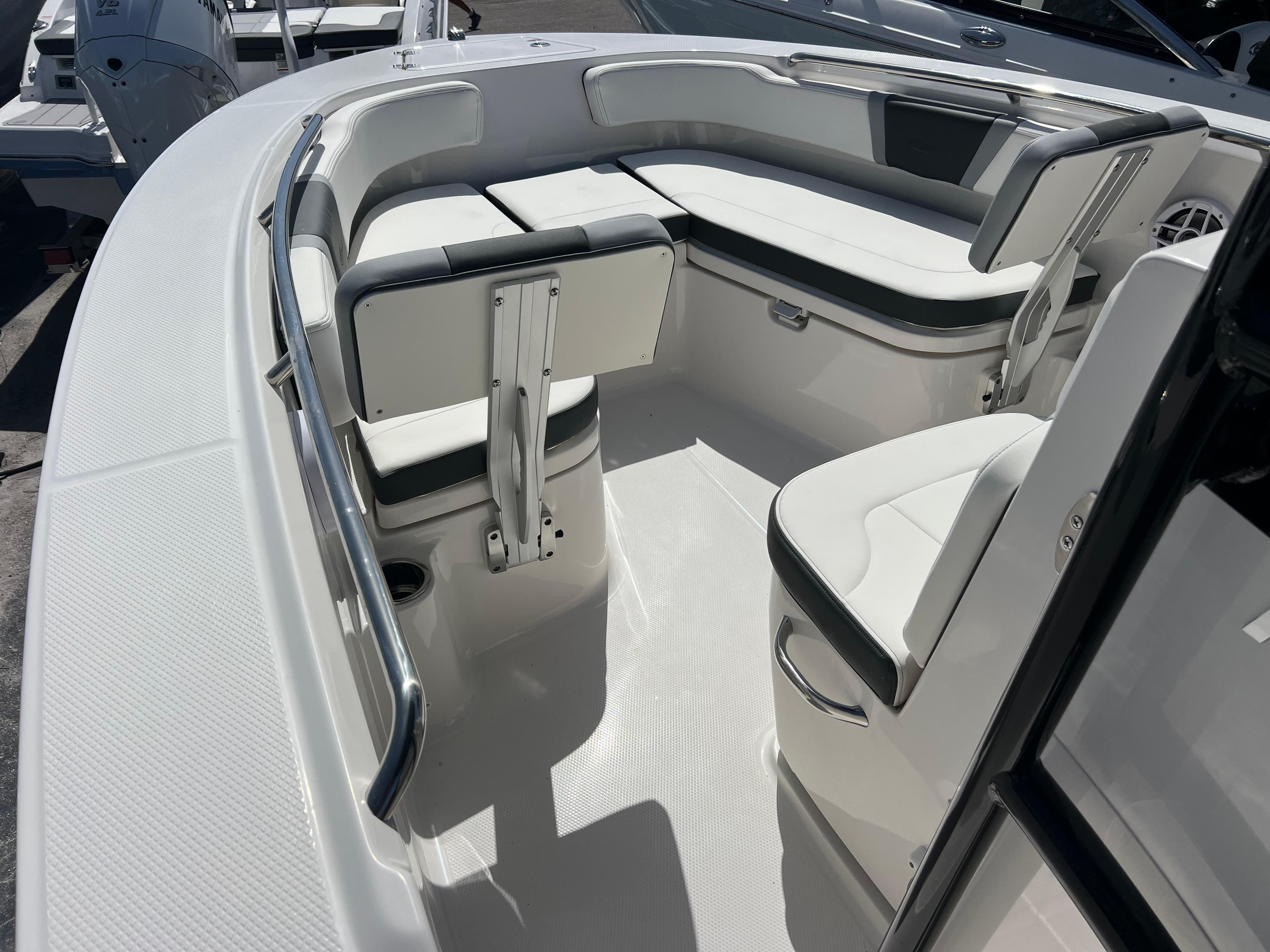 2025 Robalo R200 Center Console boat interior with white seating and stainless steel accents.