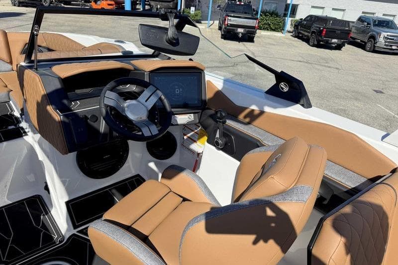 2026 Tigé Z3 boat interior with tan seats and modern dashboard controls.