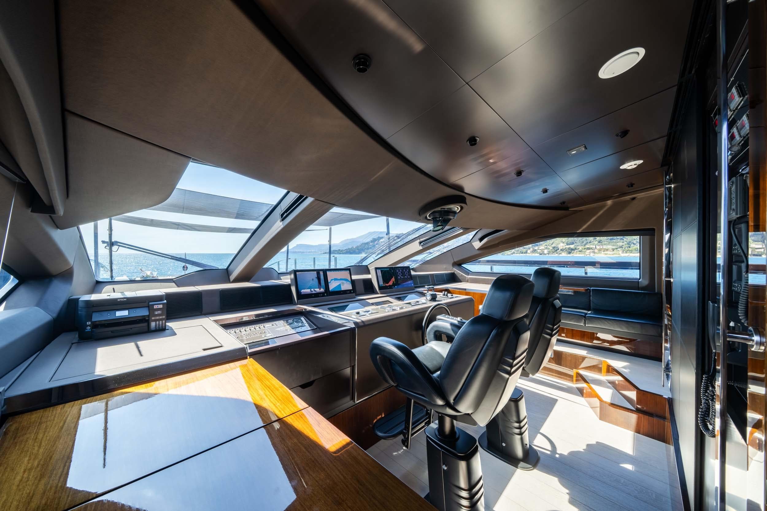 Luxurious interior of 2023 Riva 130' Bellissima yacht with modern helm and seating.