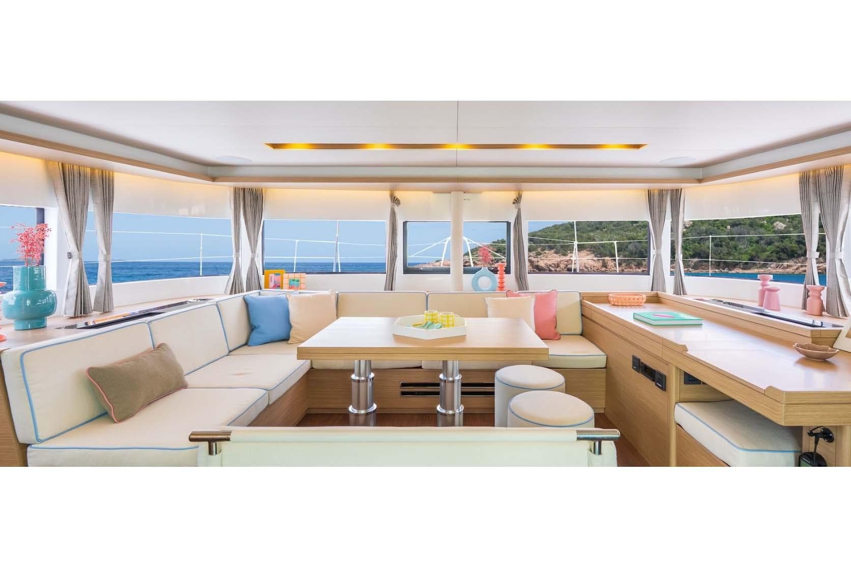 Manufacturer Provided Image: Luxurious interior of 2026 Lagoon 51 Iconic yacht with ocean view and elegant decor.