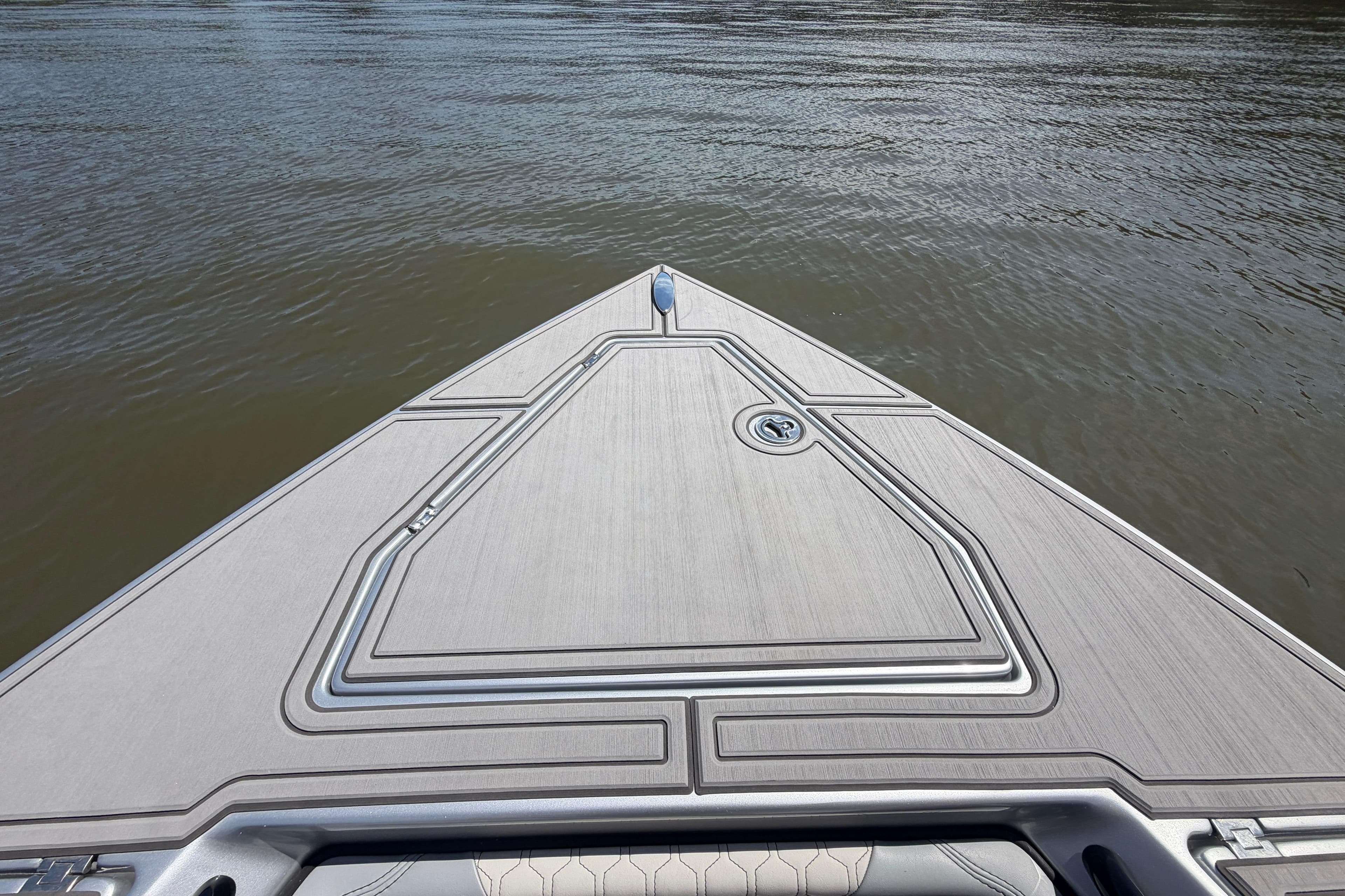 Bow view of 2024 Statement 350 Open boat on calm water.