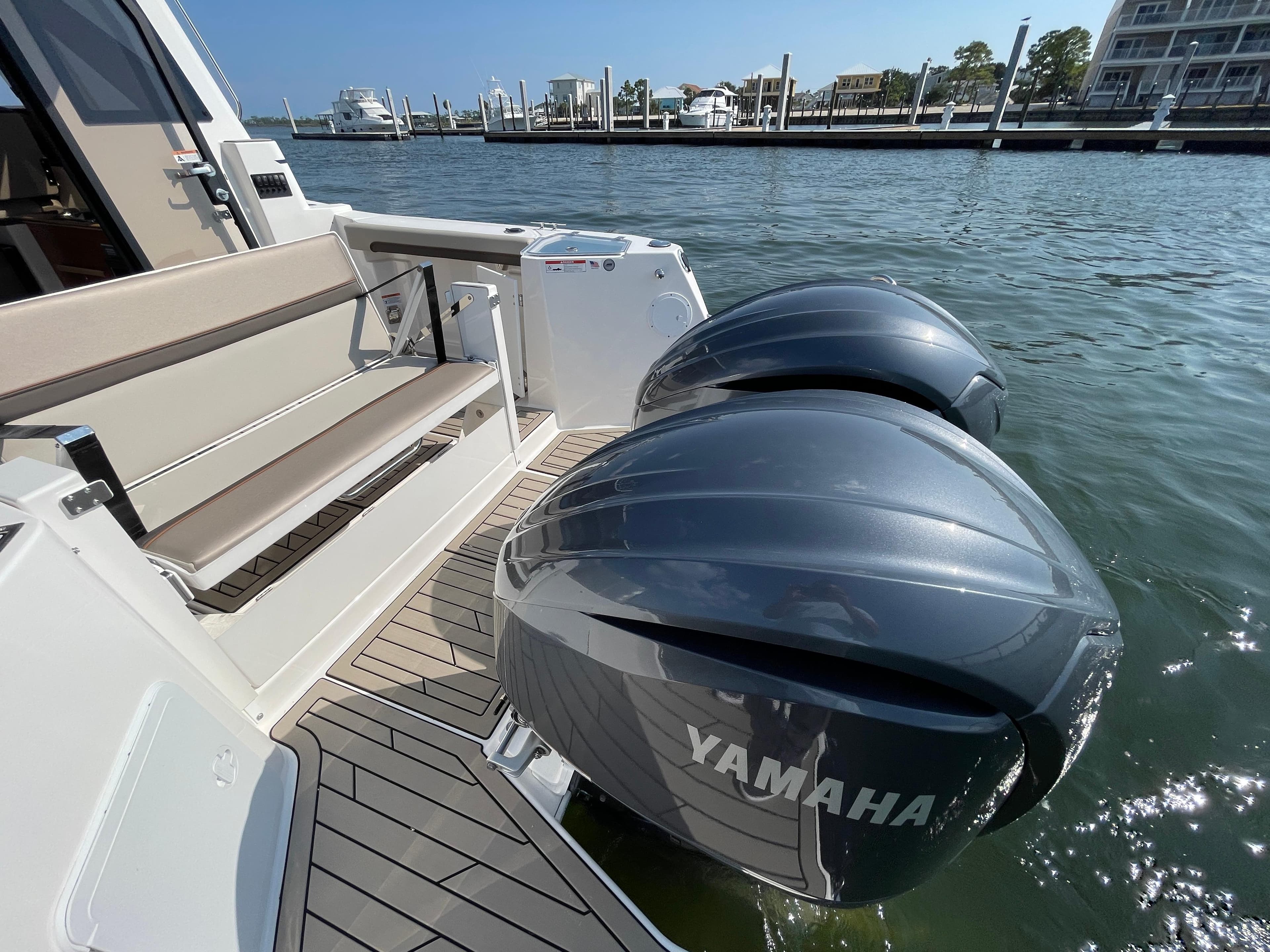 2026 Cutwater C-288 Coupe with Yamaha outboard engines docked by the water.