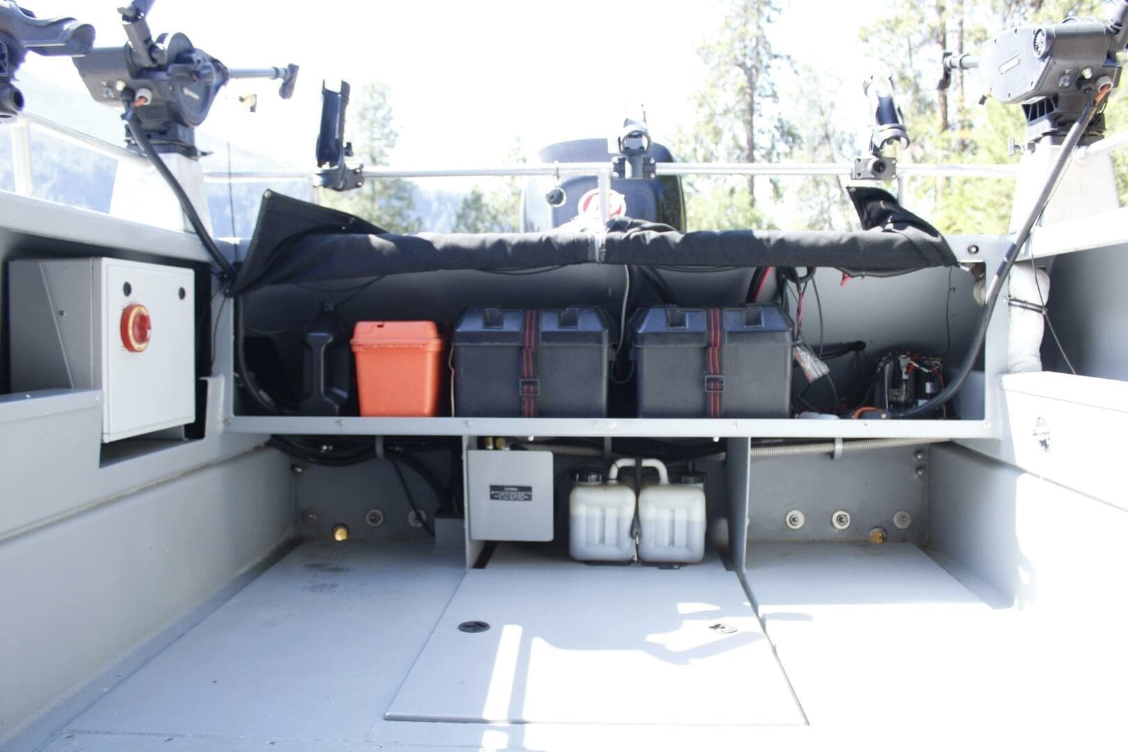 Interior of a 2005 ACB 27 boat showing storage and equipment compartments.