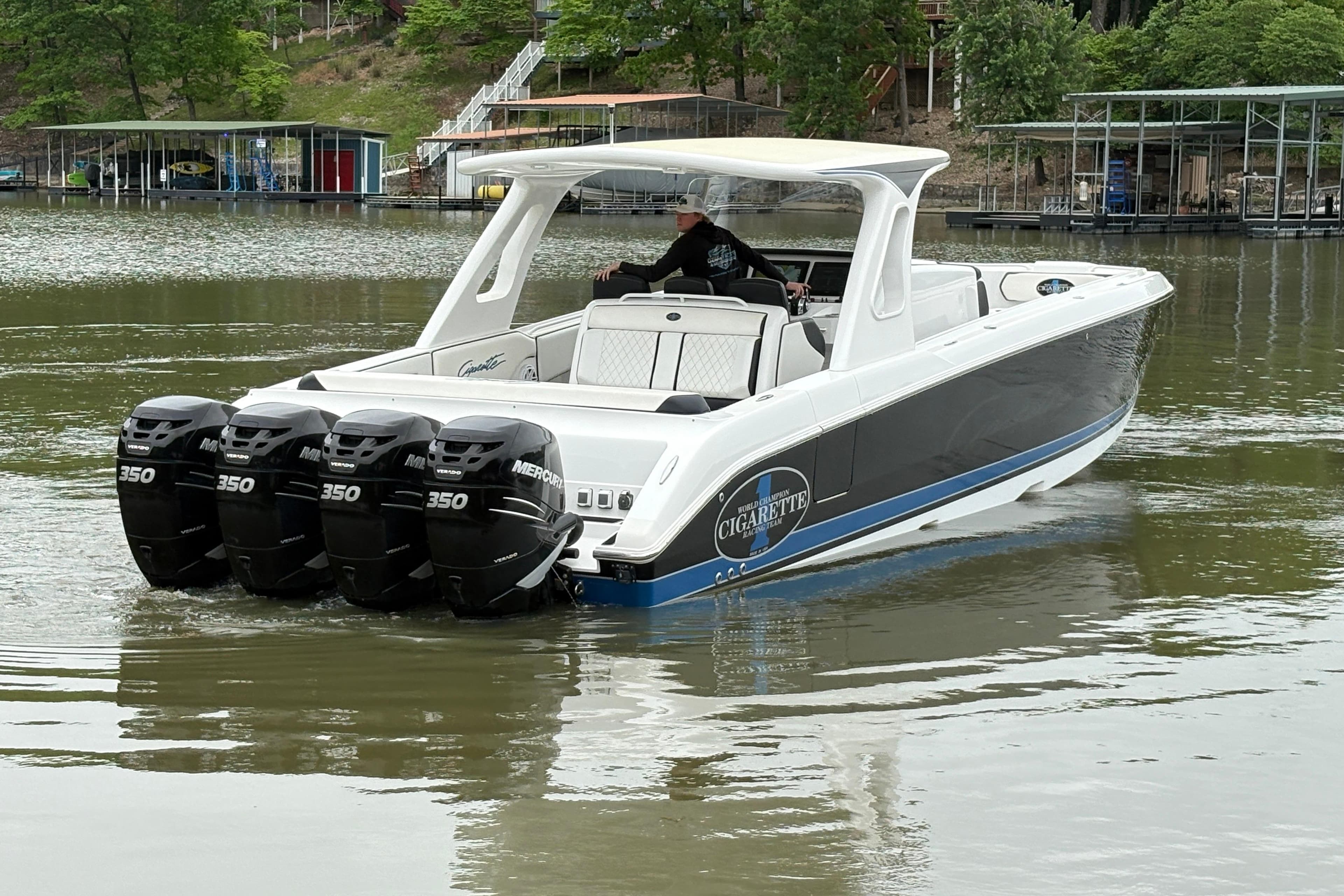 2017 Cigarette 41' GTR boat with four Mercury 350 engines on a calm lake.