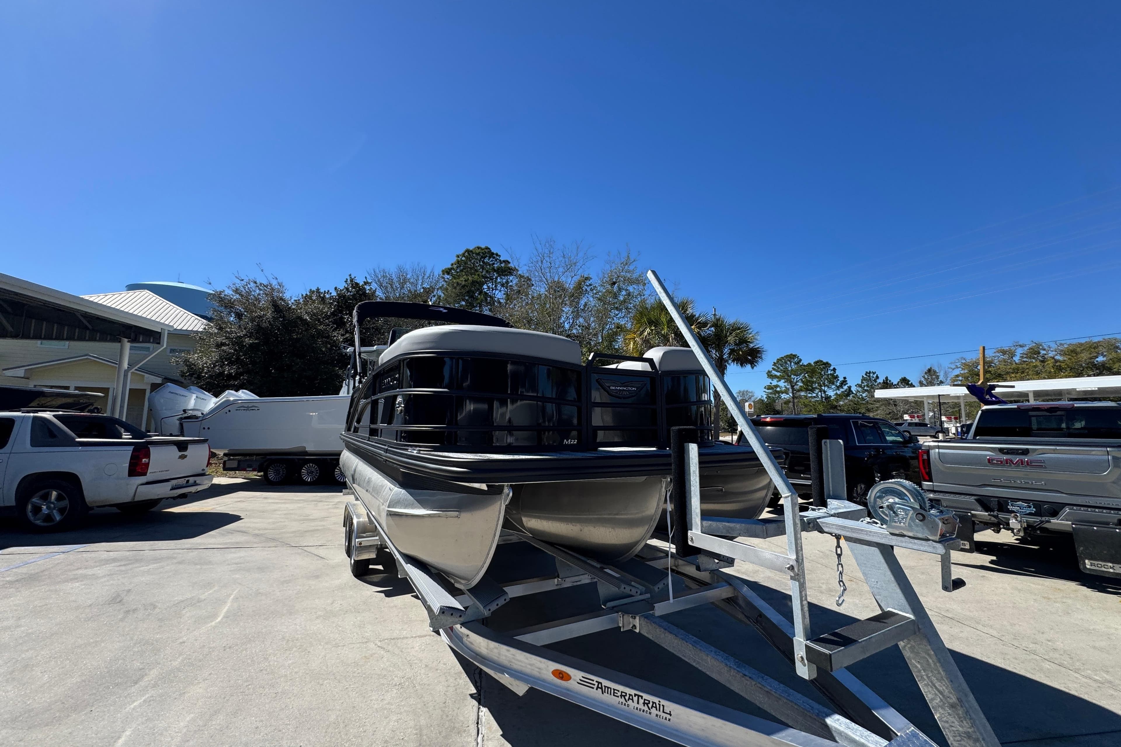 2026 Bennington 22 MSB pontoon boat on trailer in sunny outdoor setting.