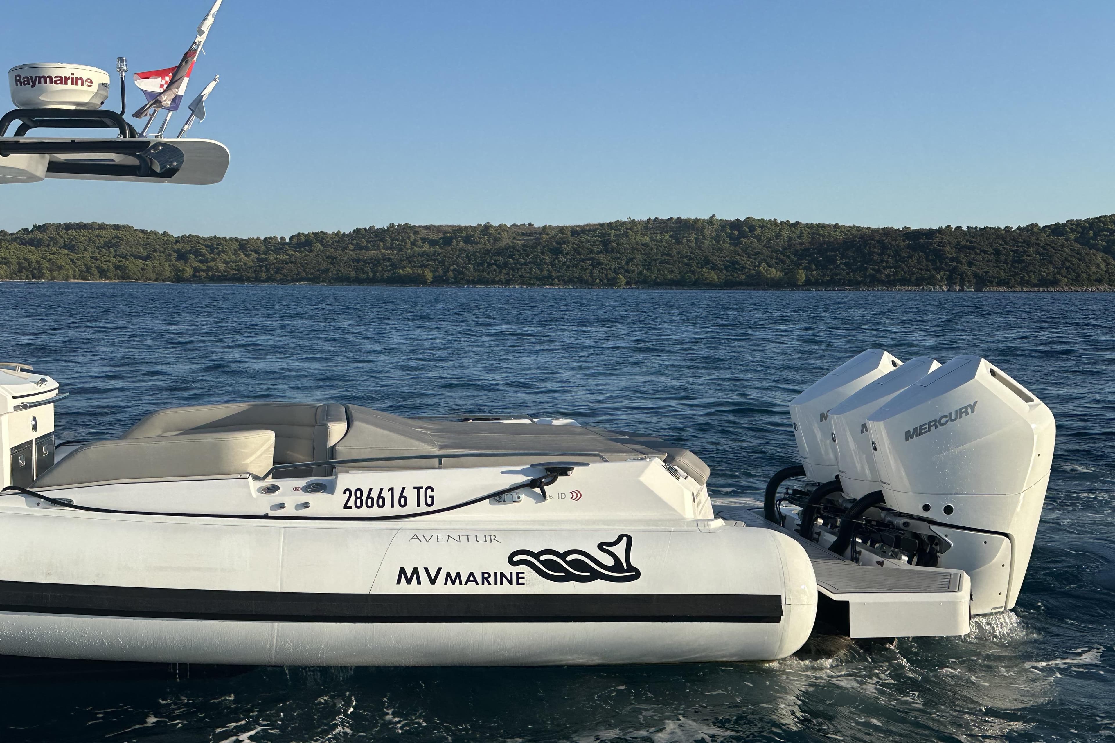 2024 MV Marine Mito 40 boat with Mercury engines on a serene water backdrop.