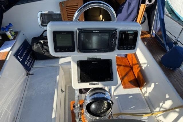 Cockpit of 1986 Fairweather Mariner 39 with navigation instruments and compass.