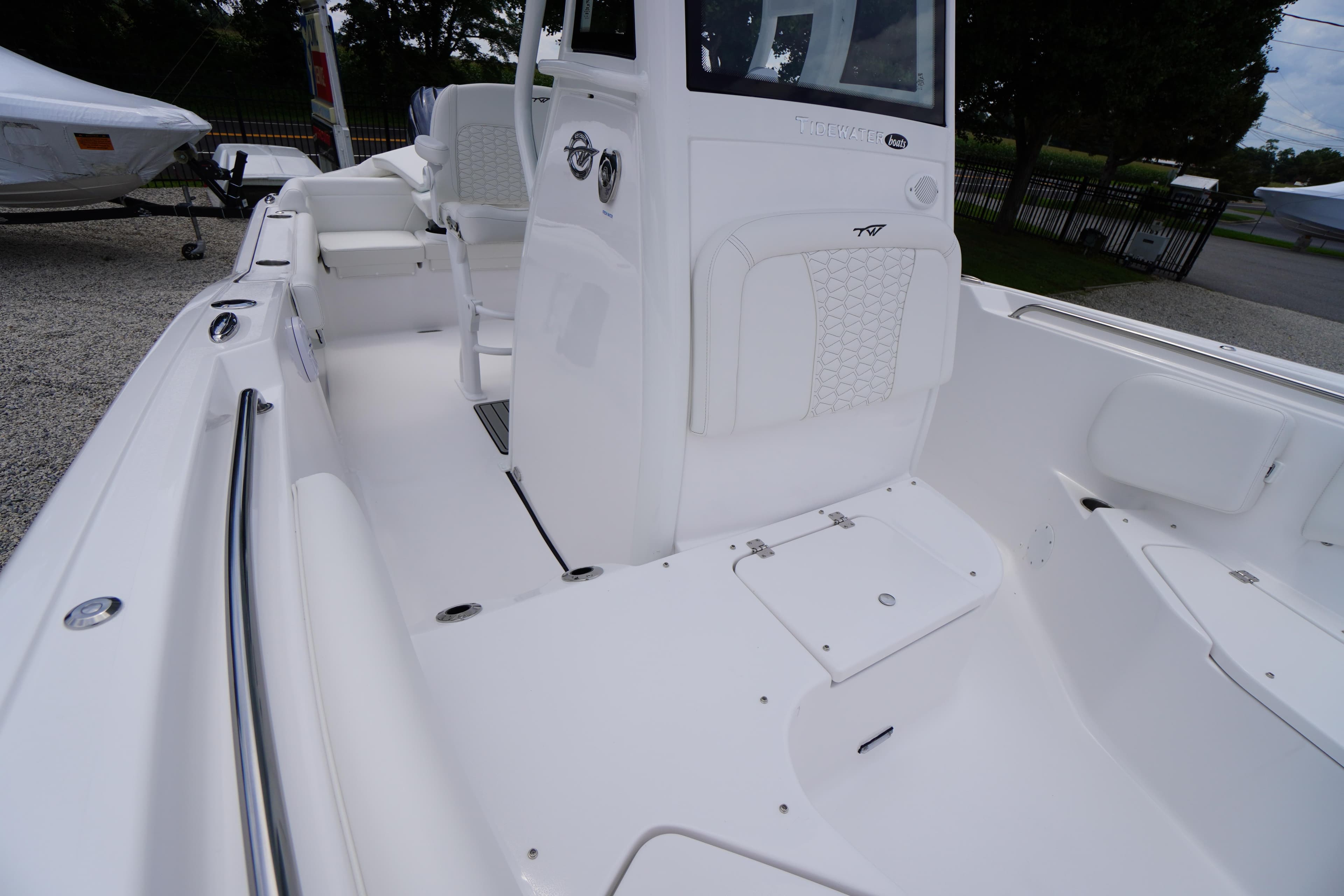 2026 Tidewater 232 SS boat interior with white seating and sleek design.