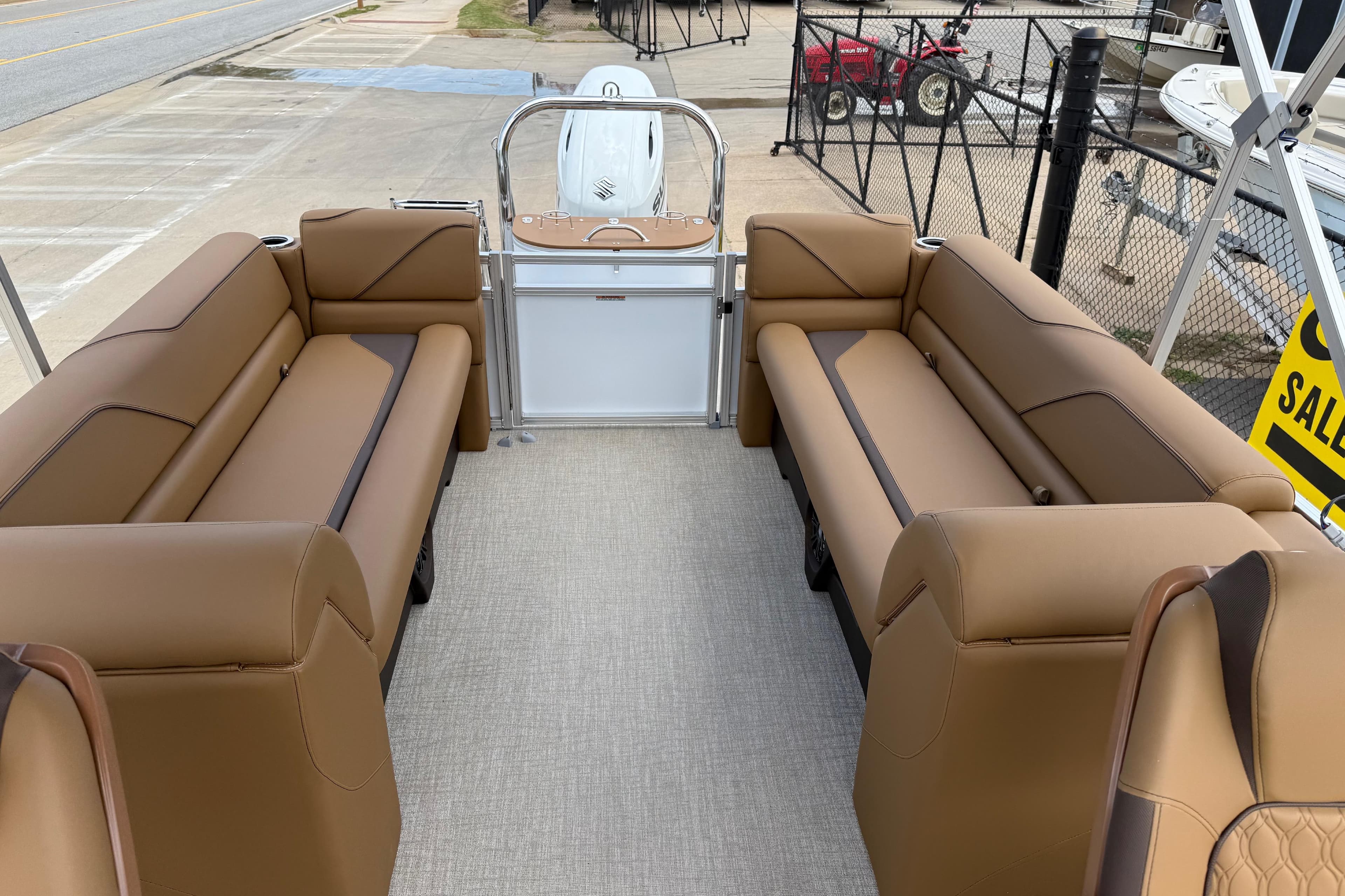 2026 Avalon VENTURE QUAD LOUNGE interior with tan seating, displayed outdoors.