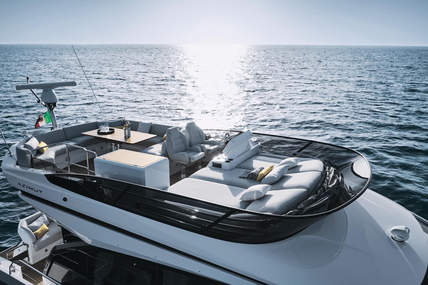 2024 Azimut 53 Fly yacht with luxurious deck, cruising on open sea.