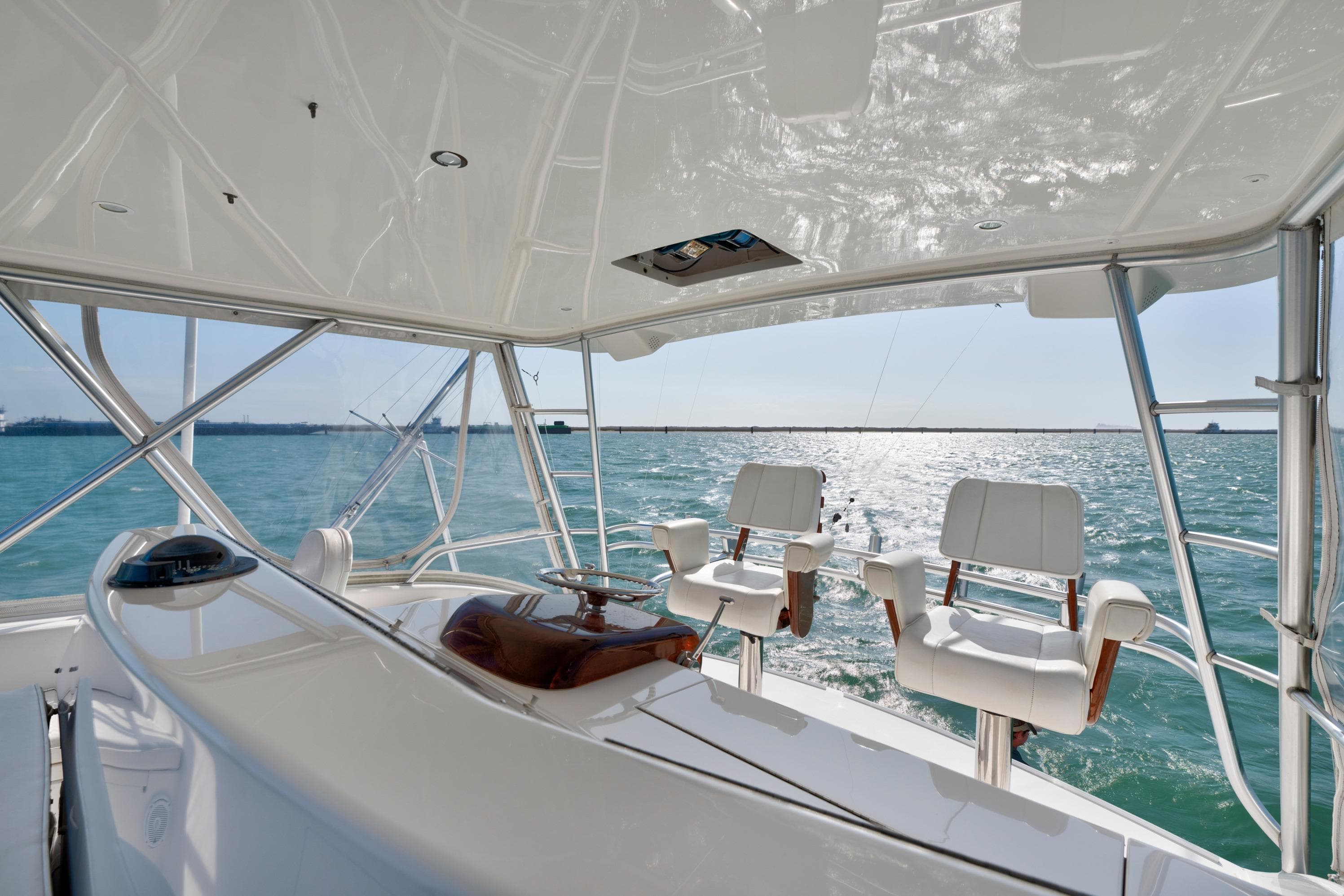 2008 Viking Convertible yacht helm with ocean view and luxurious seating.