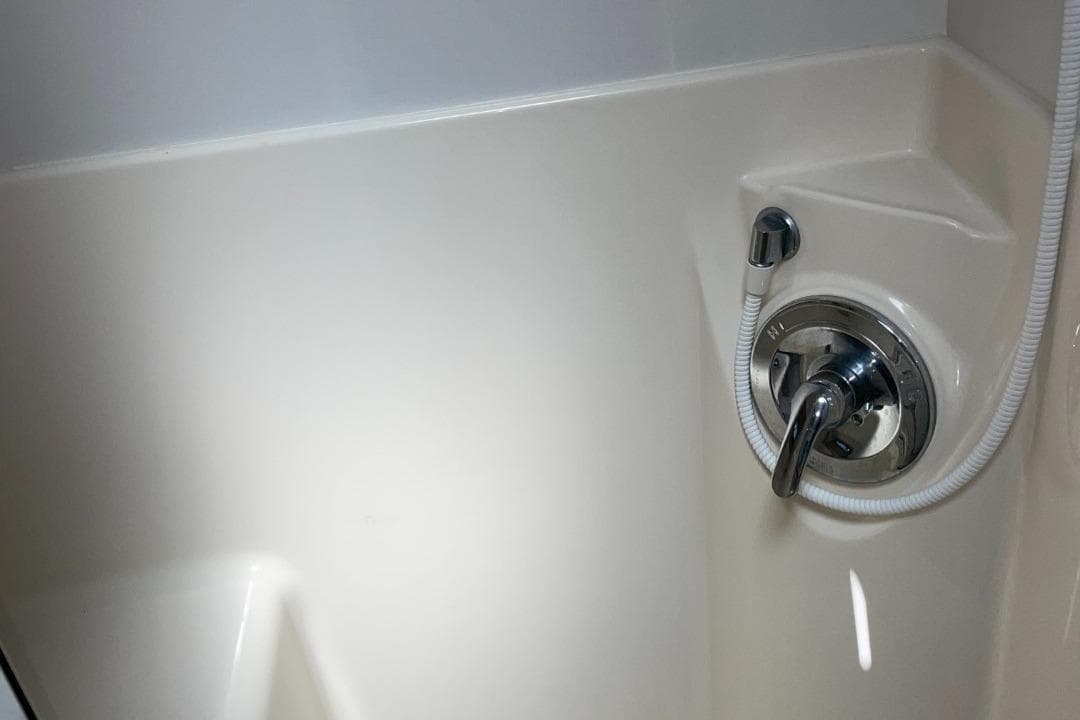 Shower control panel in 1999 Bayliner 3388 Motoryacht bathroom.