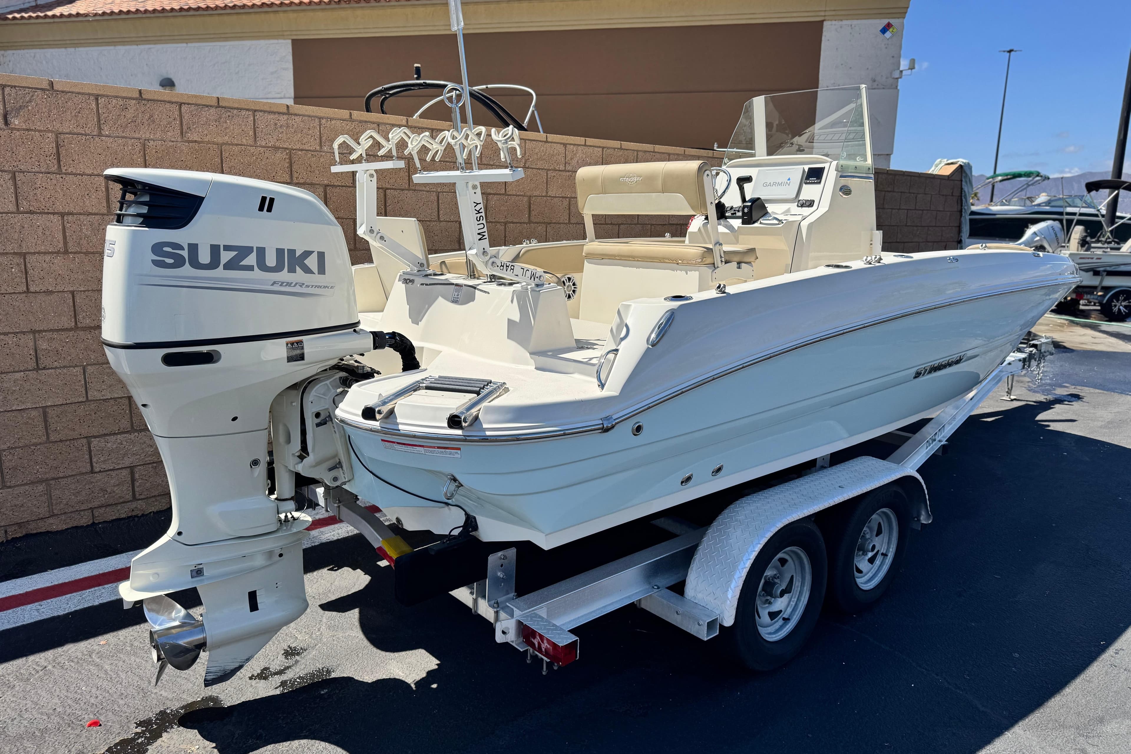 2019 Stingray 206 CC boat with Suzuki outboard motor on trailer.