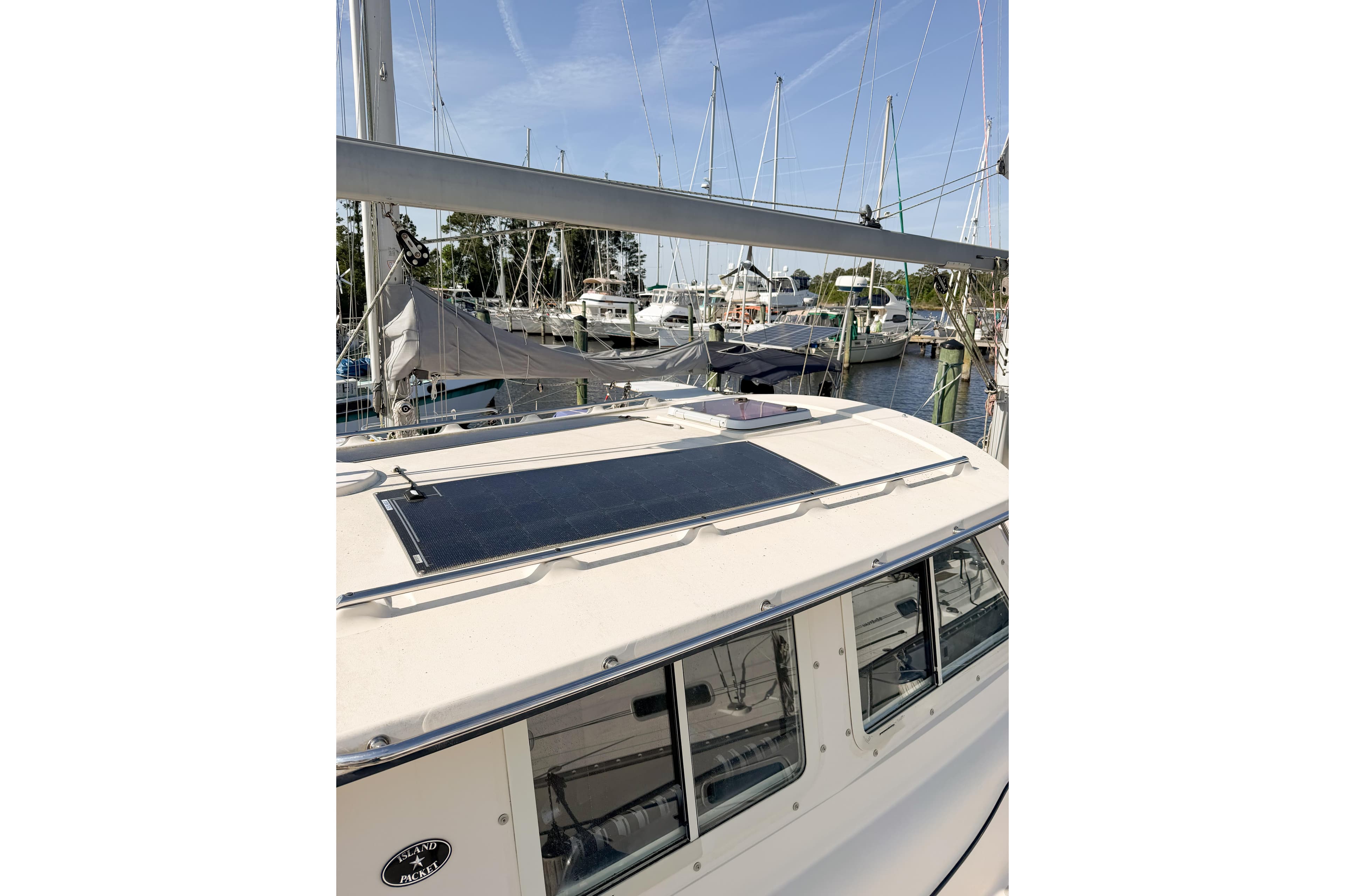 2007 Island Packet SP Cruiser docked, featuring solar panel on cabin roof.