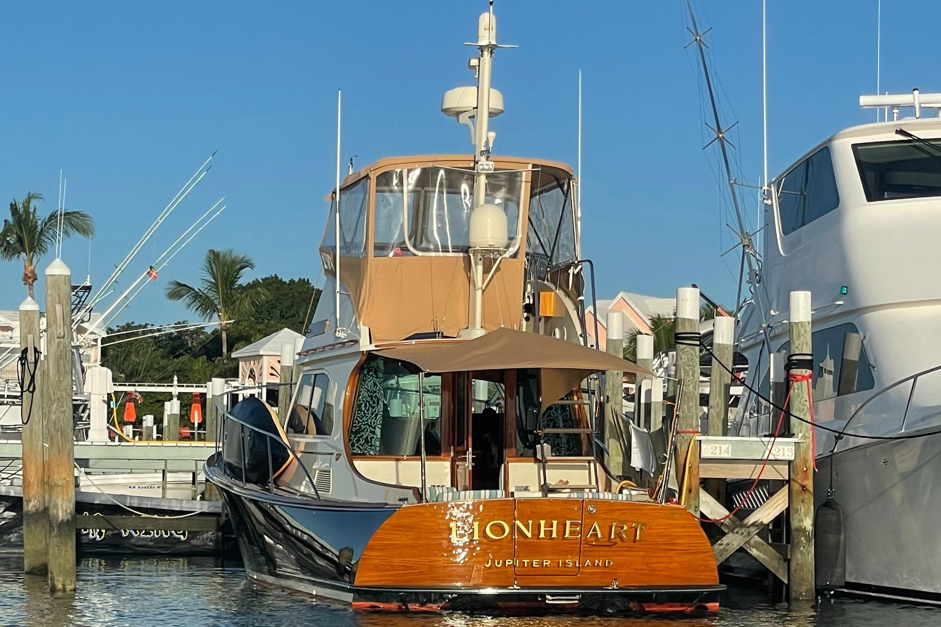 2008 Hinckley Talaria 44 FB yacht docked at marina, sunny day.