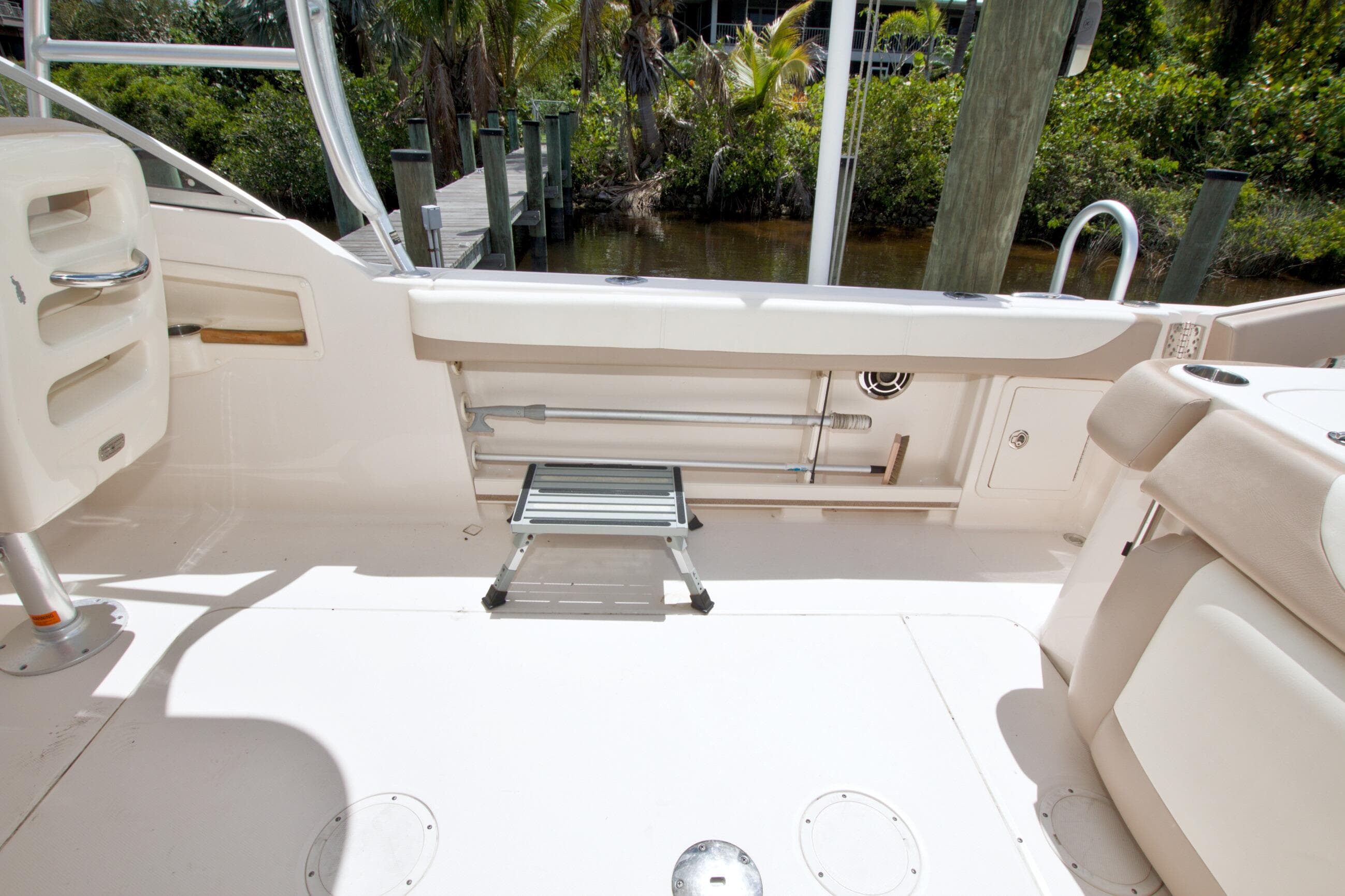 2013 Grady-White Freedom 275 boat interior with seating and storage, dockside view.