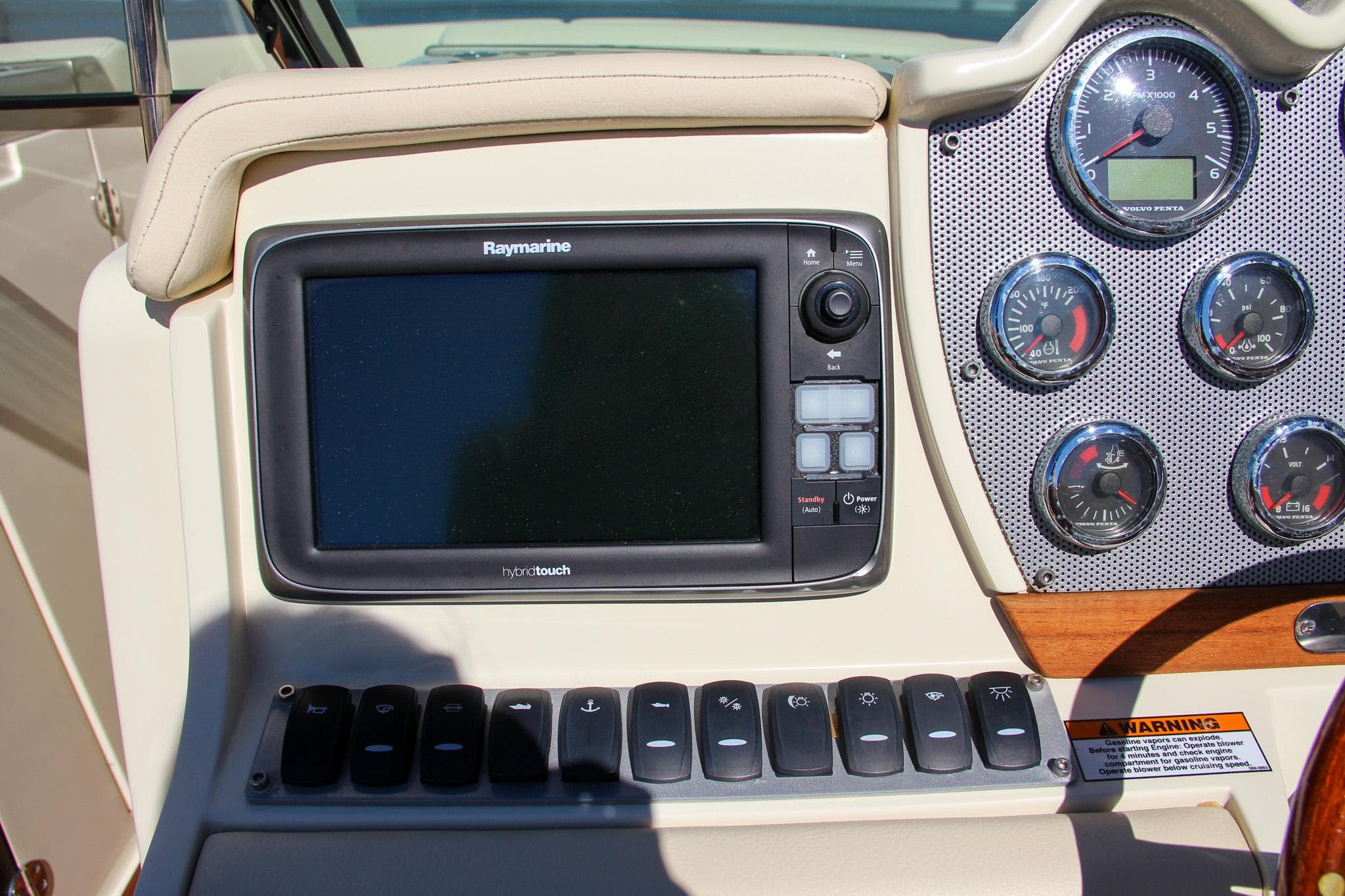 Dashboard of 2013 Chris-Craft Launch 32 with Raymarine display and gauges.