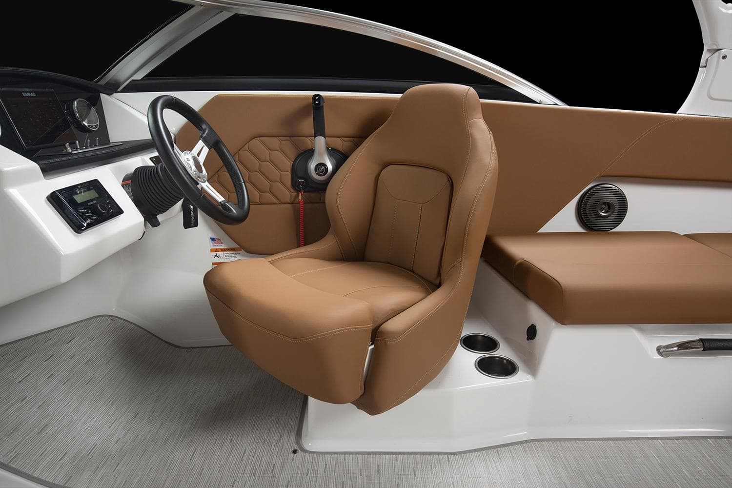 Manufacturer Provided Image: 2025 Four Winns H1 OB boat interior with brown seating and modern dashboard.