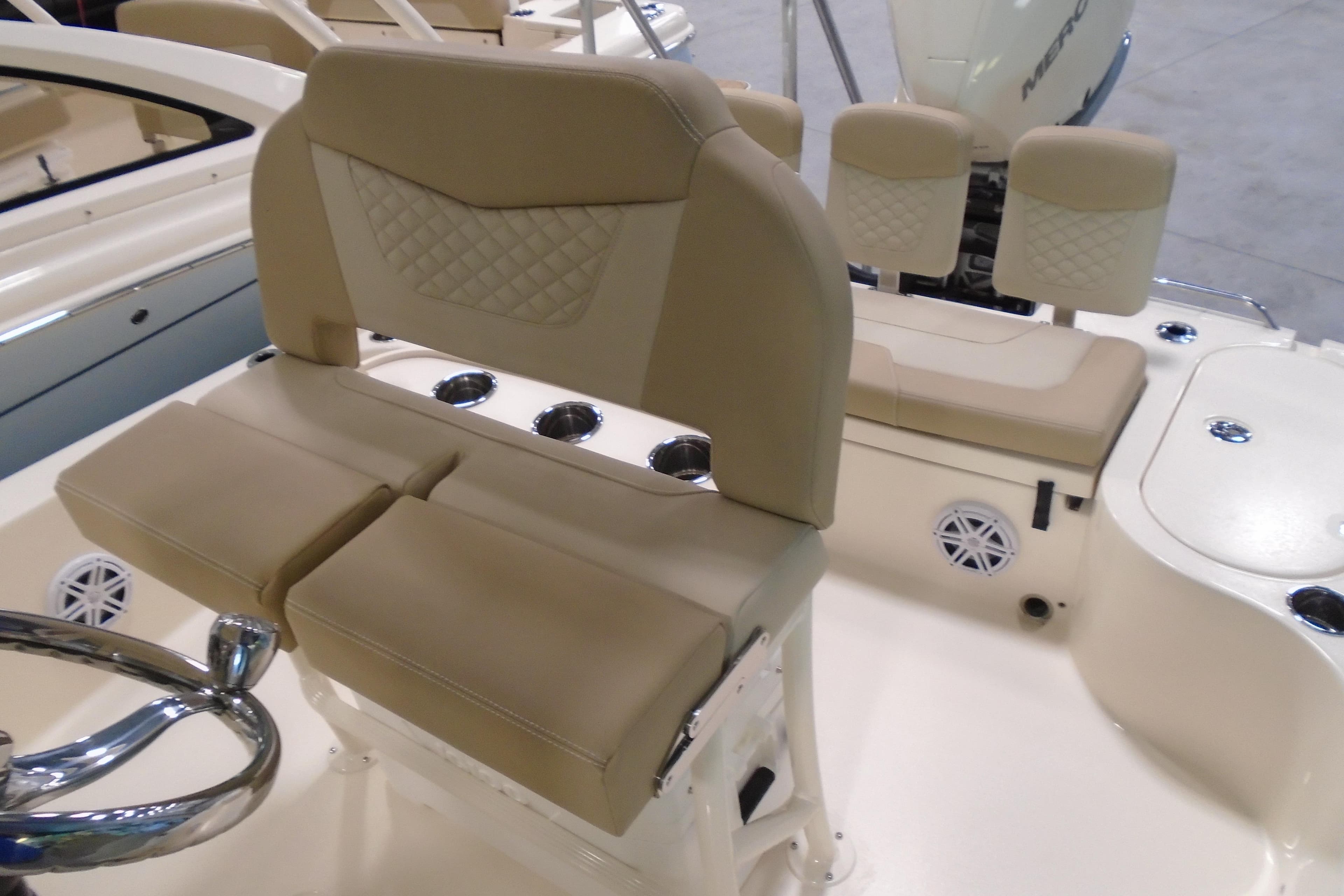 2026 Scout 231 XSB boat interior with beige seating and steering wheel.