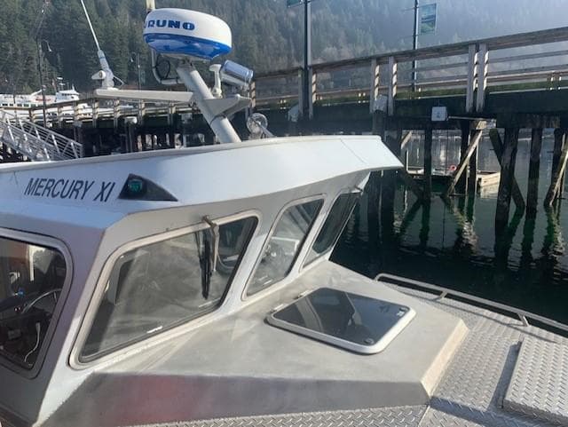 EagleCraft 1994 workboat docked, featuring radar equipment and cabin windows.