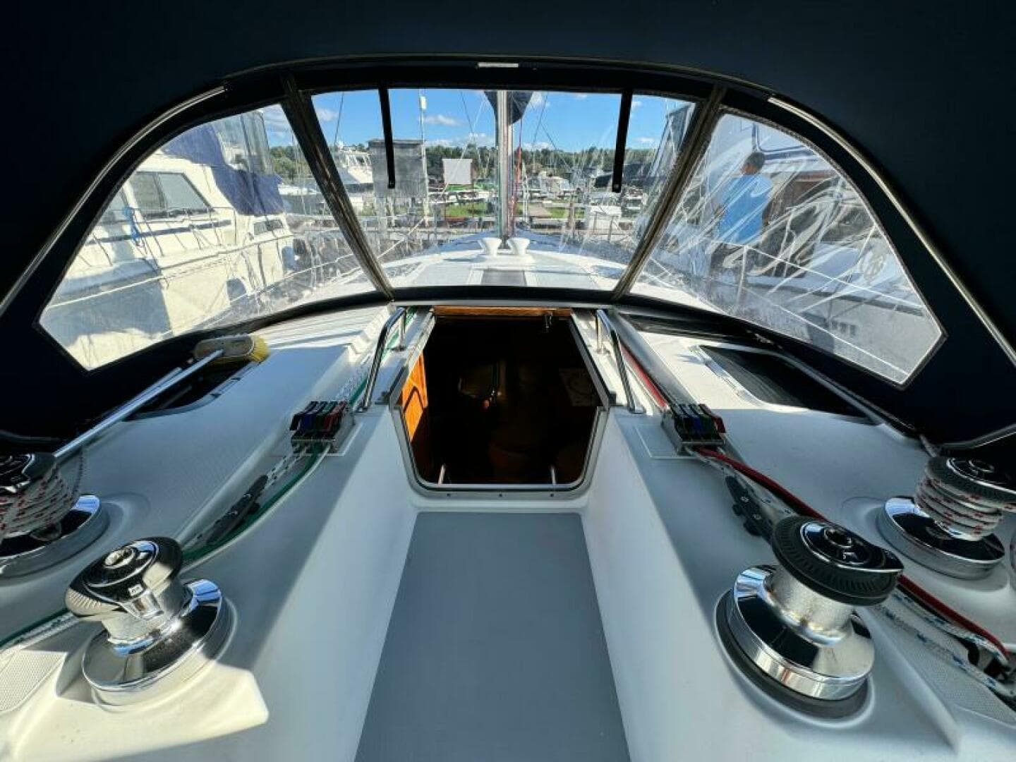 Interior view of a 1995 Hunter 430 sailboat cockpit with winches and ropes.