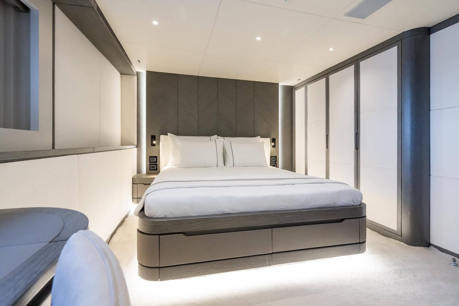 Luxurious bedroom interior on 2022 CMB Yachts CMB 47, featuring modern design and ambient lighting.