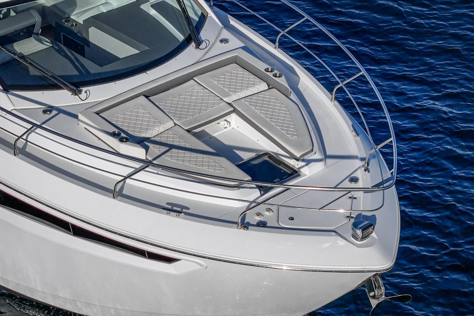 2023 Cruisers Yachts 42 Cantius bow view, featuring sleek design and luxurious deck seating.