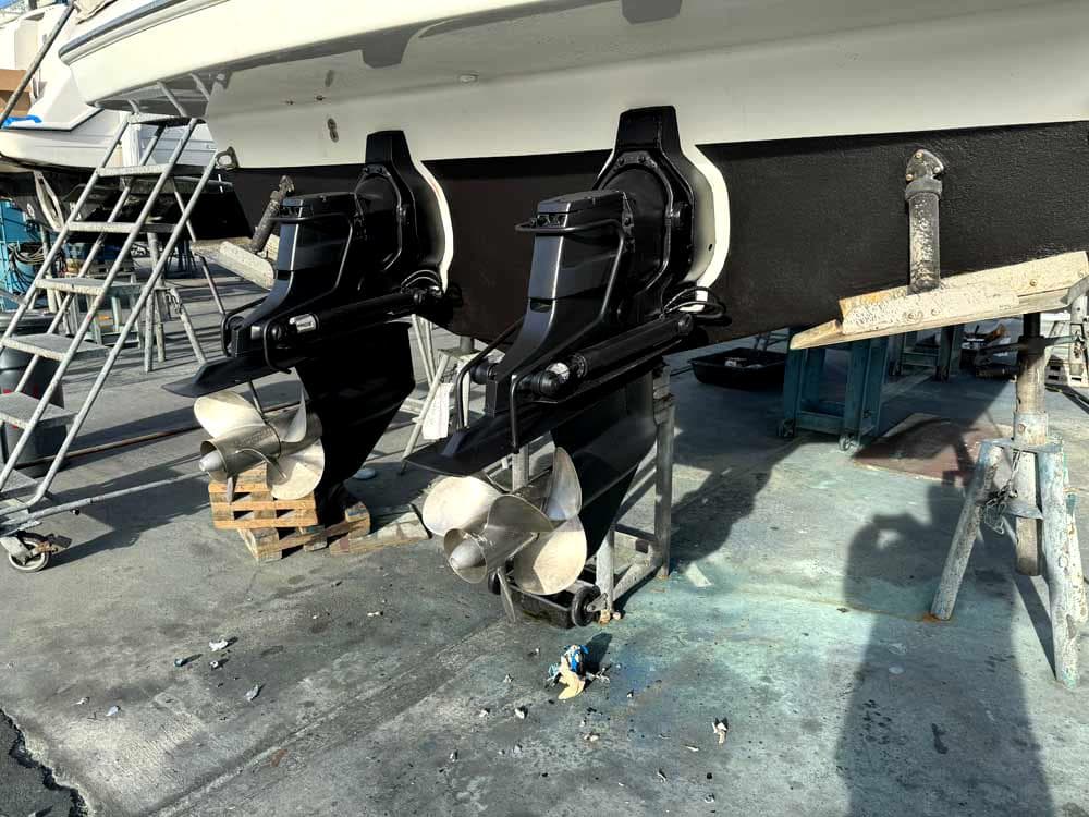 2005 Formula 31 Performance Cruiser with dual propellers in a boatyard setting.