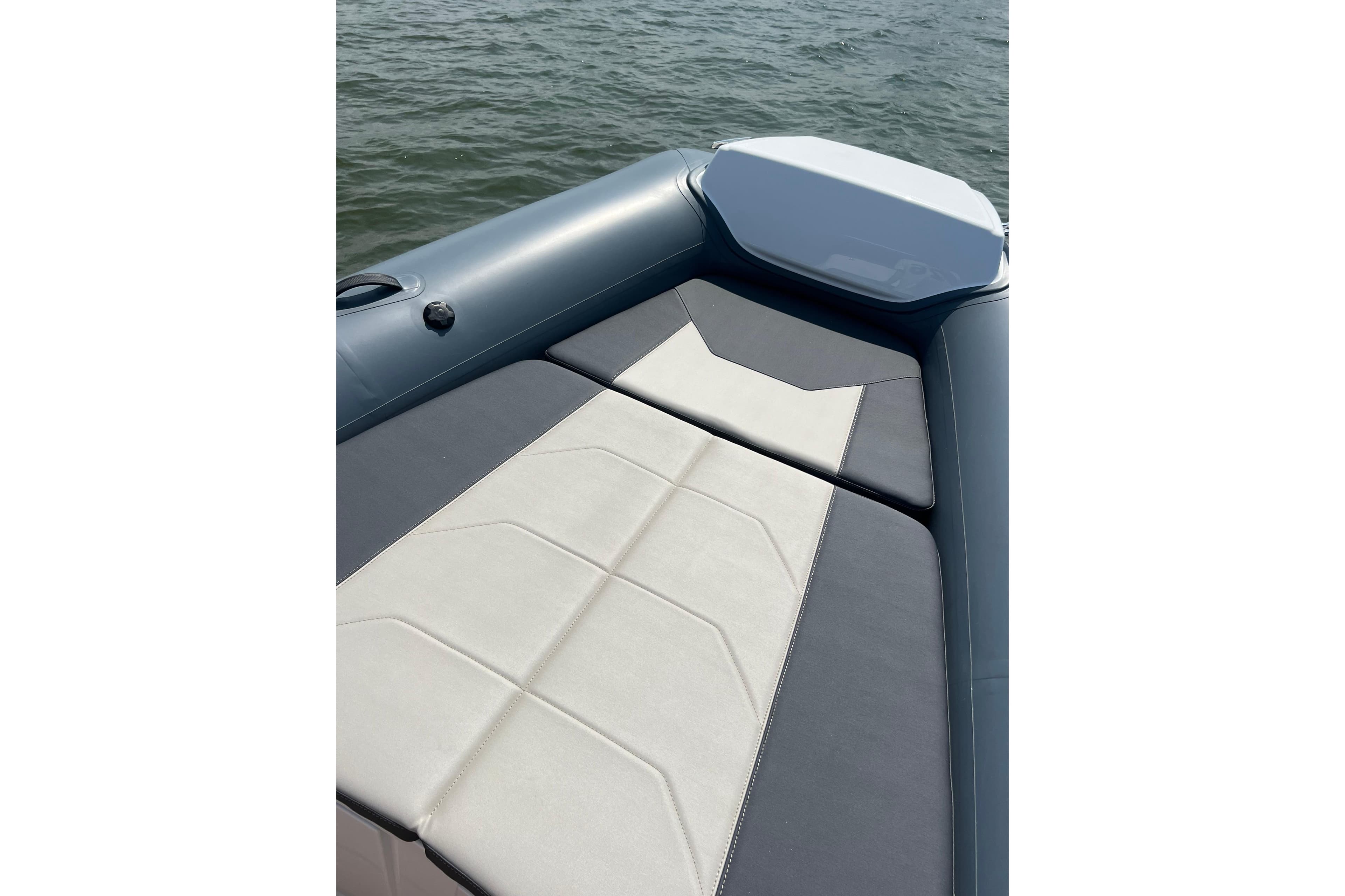 2025 Grand Inflatables G850 boat with sleek seating on calm water.
