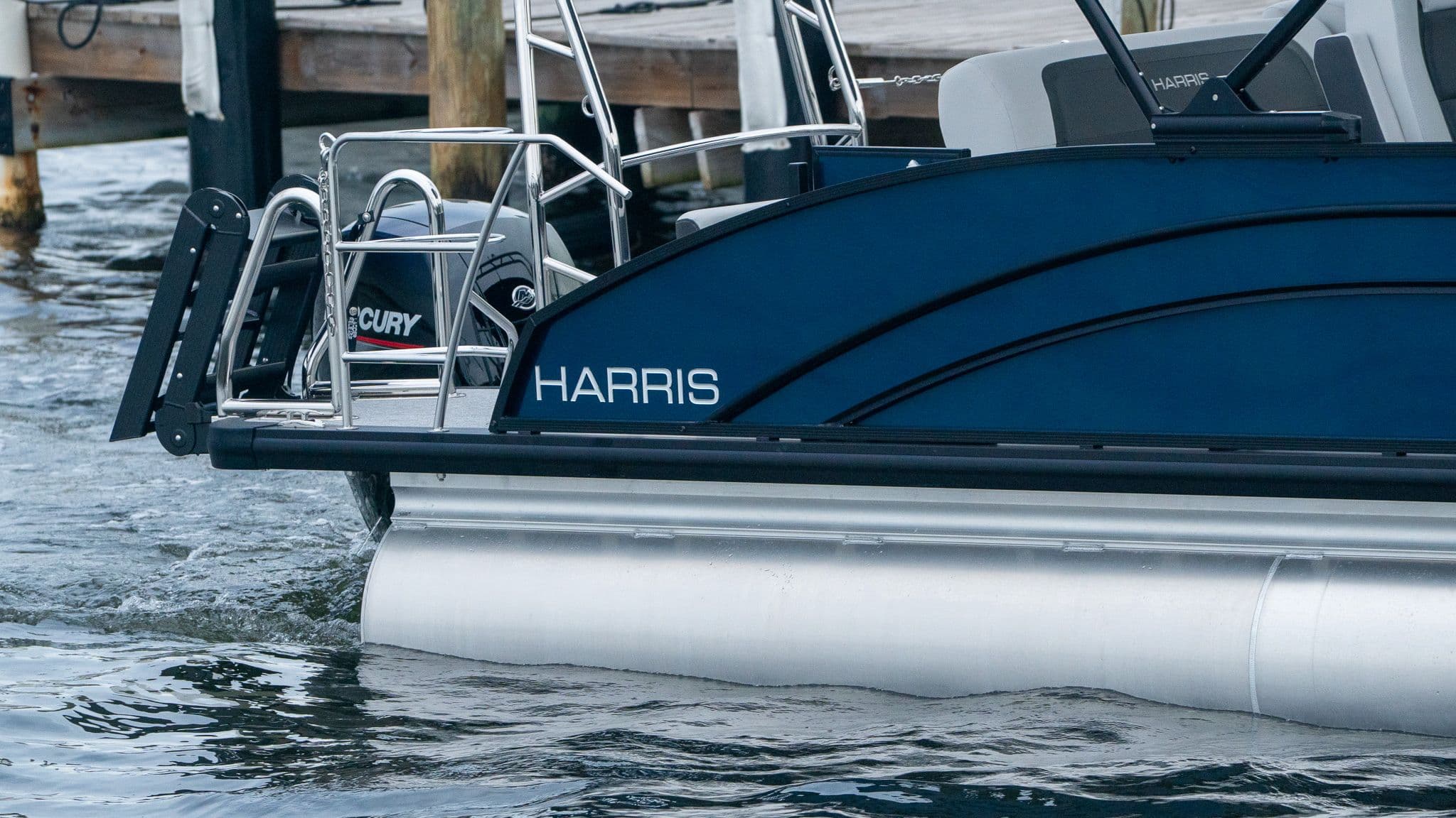 Harris Cruiser 230 boat on water, model year 2026.