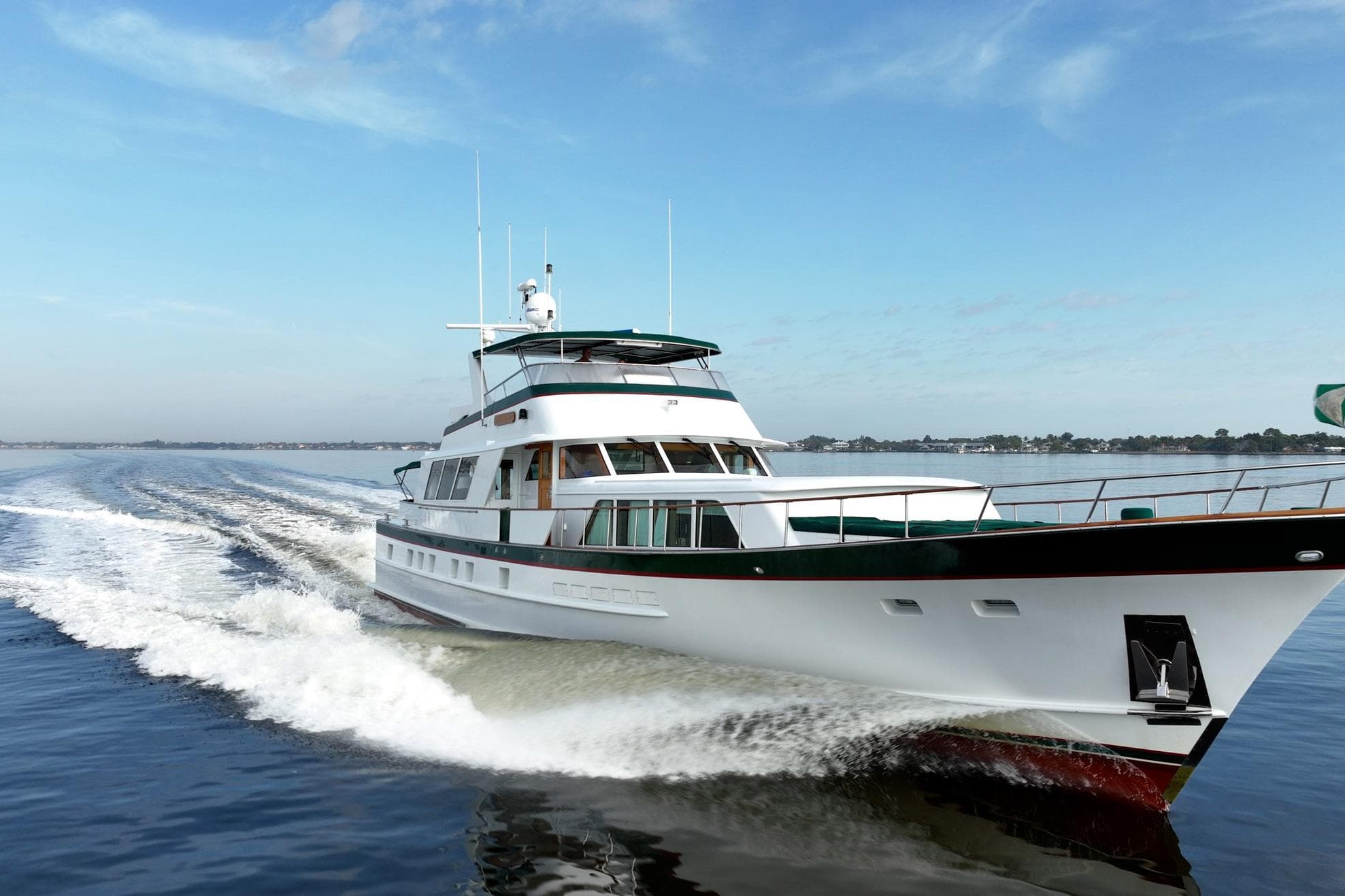 Luxury yacht cruising on open water, Burger 91 model, 1984.