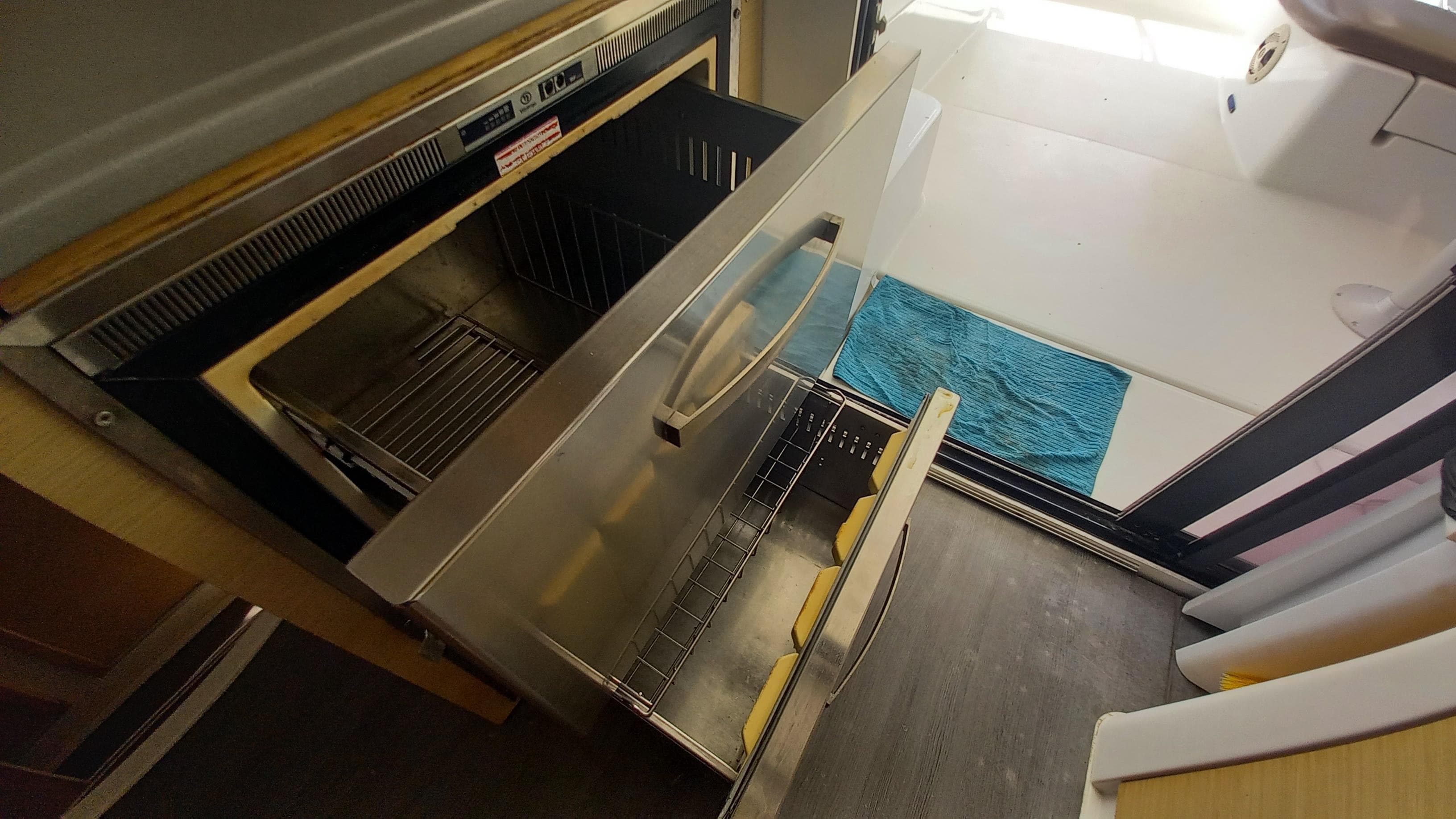 Open drawer in 2015 Fountaine Pajot Lipari 41 catamaran kitchen, showcasing storage space.