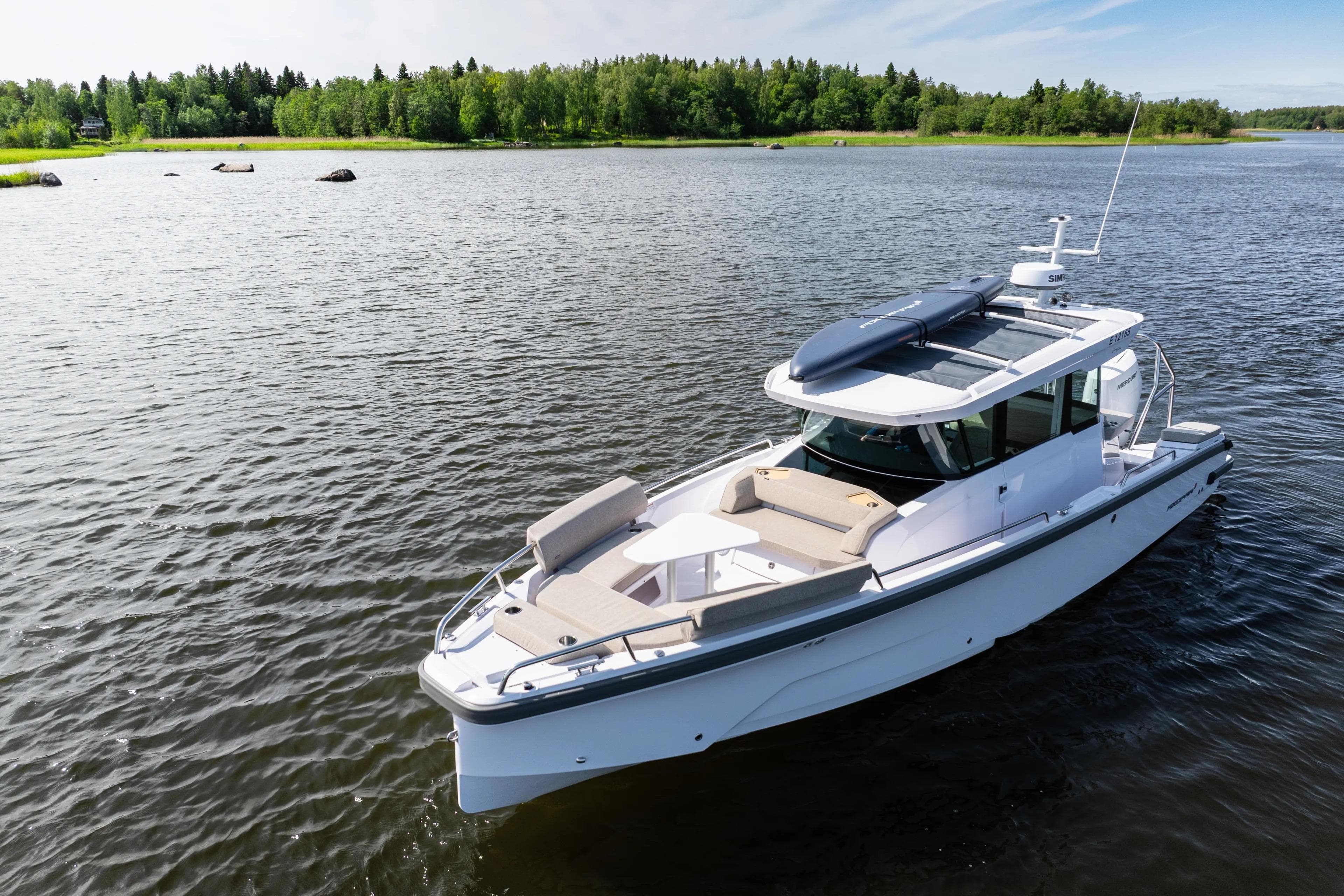 2026 Axopar 29 XC Aft Sofa Twin 200 Brabus Sandstone on serene lake.