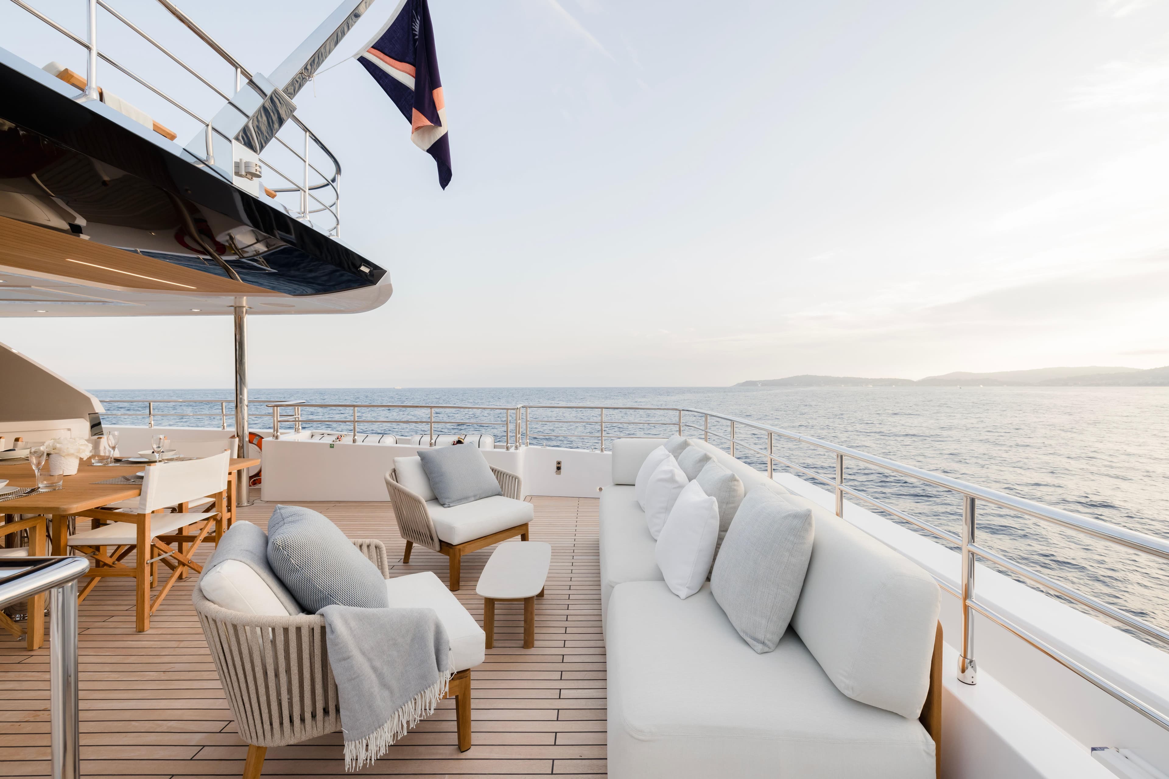 Luxurious 2025 Majesty 120 yacht deck with elegant seating and ocean view.