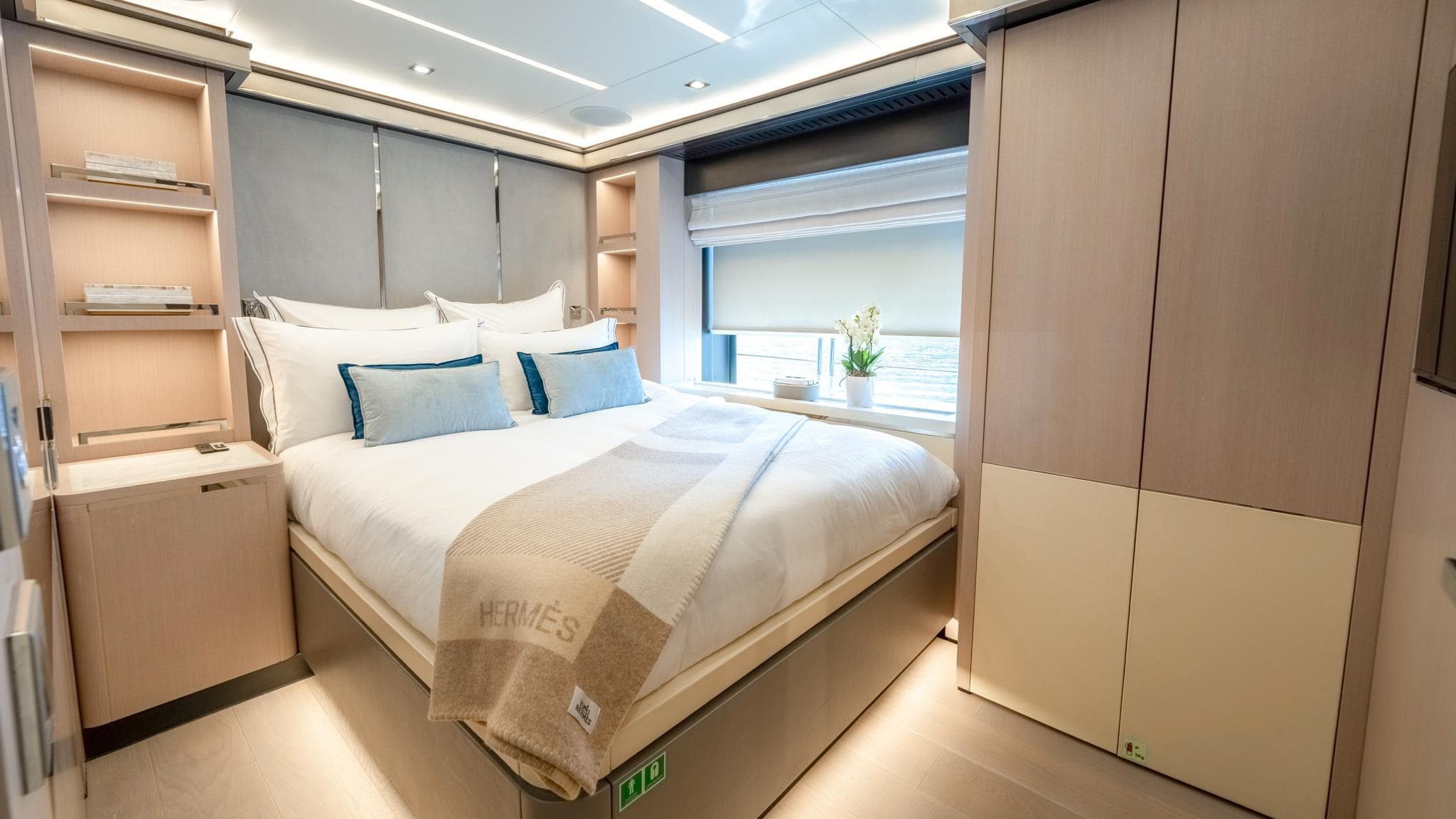 Luxurious bedroom interior on 2016 Mondomarine 50 metre yacht, featuring elegant design and cozy bedding.