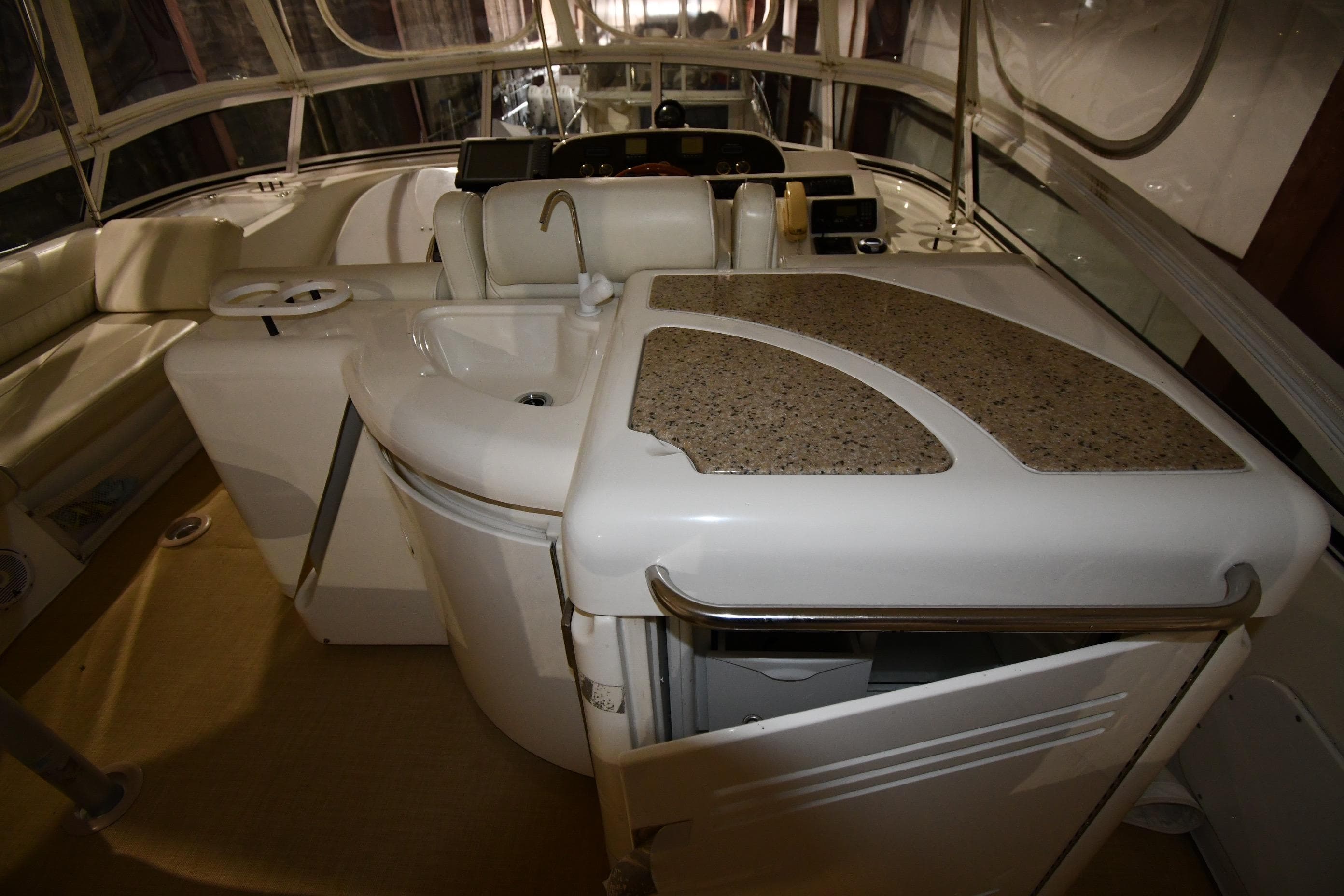 2003 Cruisers Yachts 5000 Sedan Sport interior with sink and seating area.